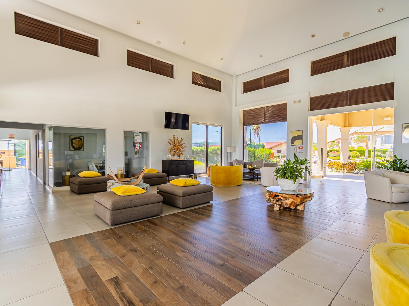 - Step into our resort's lobby in Noord, Aruba, where sophisticated design meets warm hospitality. - Experience a grand welcome in our beautifully appointed lobby area, setting the tone for your stay. - Relax in our resort's lobby with cozy sitting.