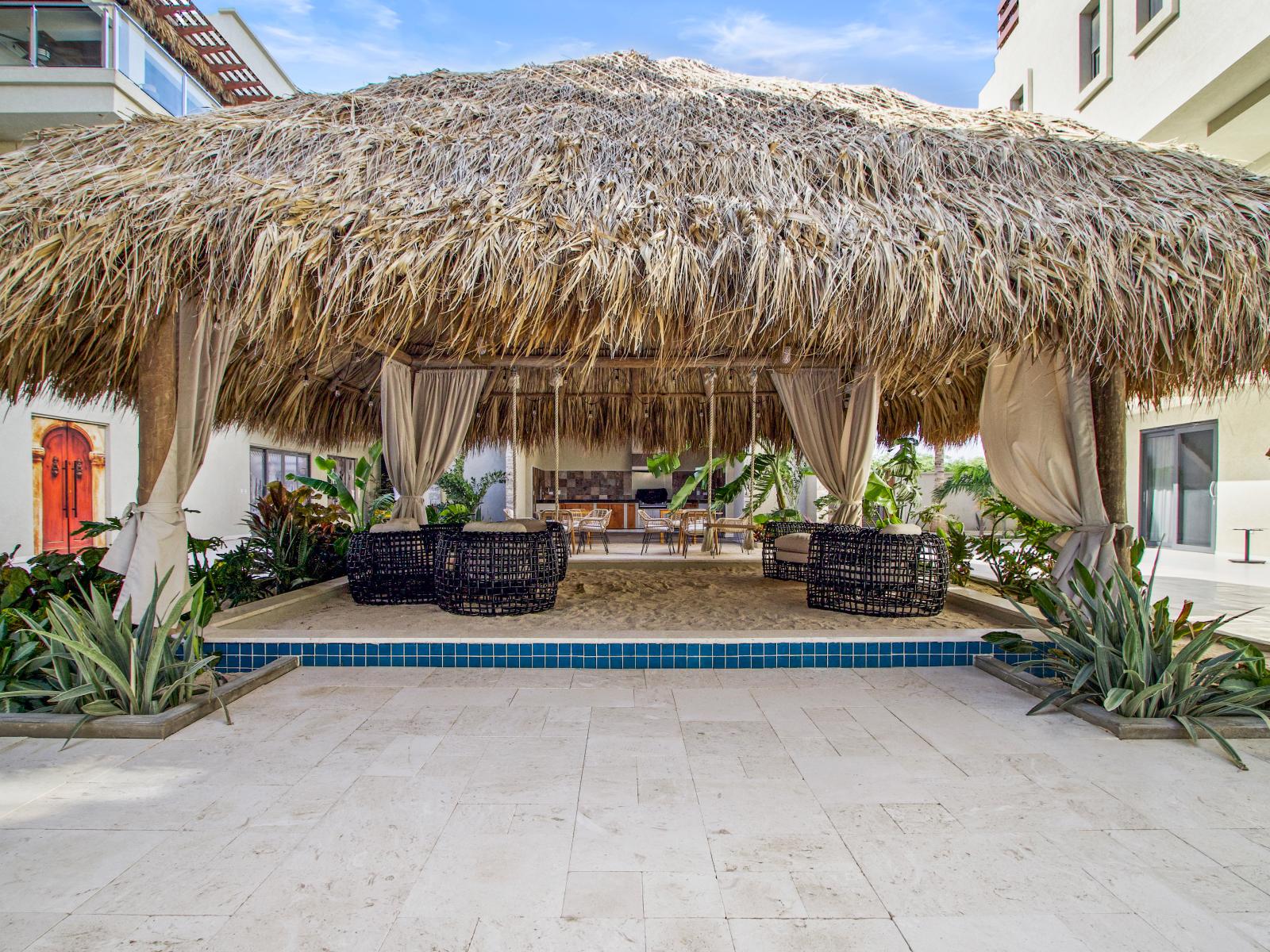 Relaxing in the gazebo, where sand meets swings and serenity.