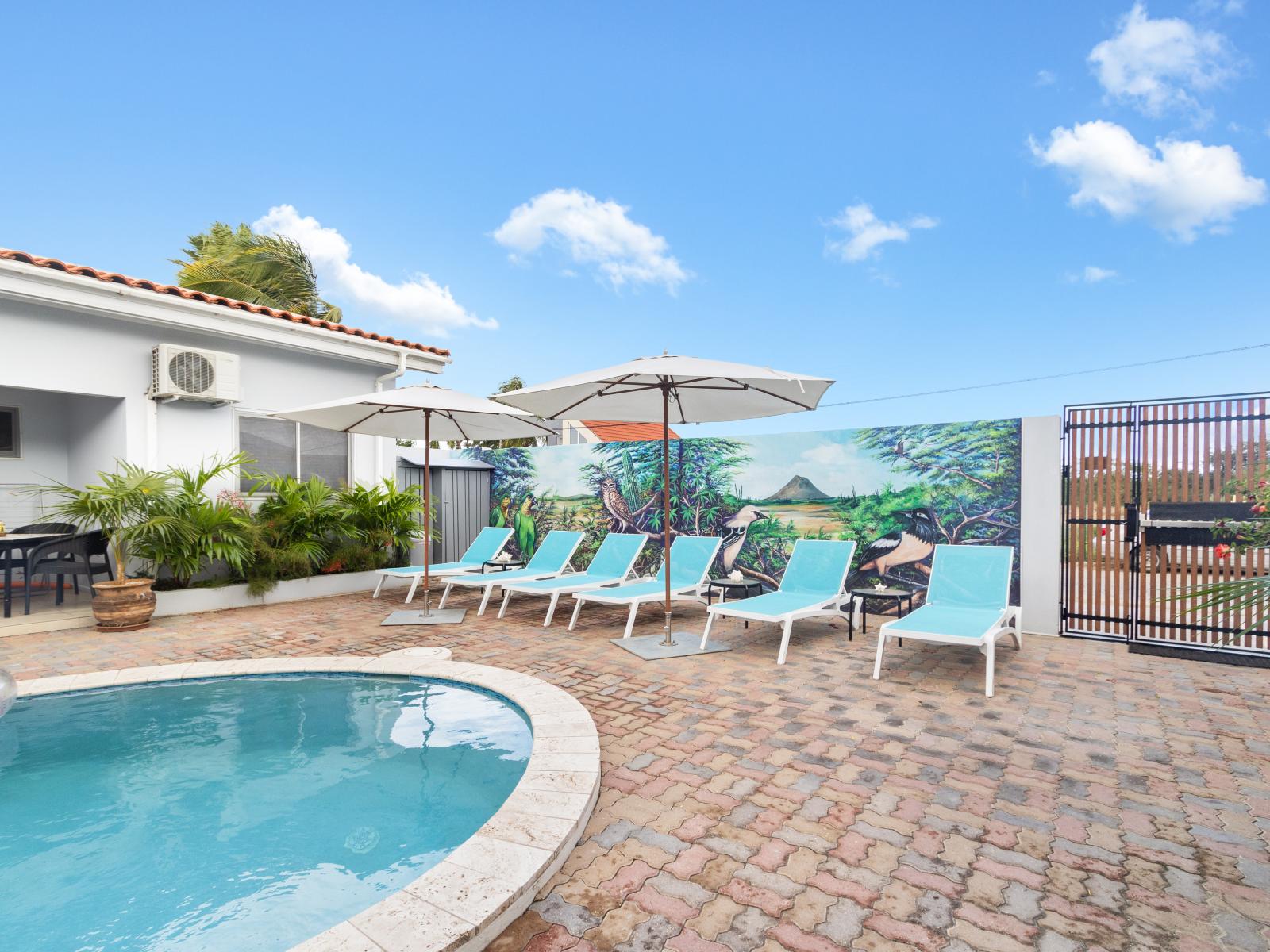 Shared Pool Area with Lounge Chairs