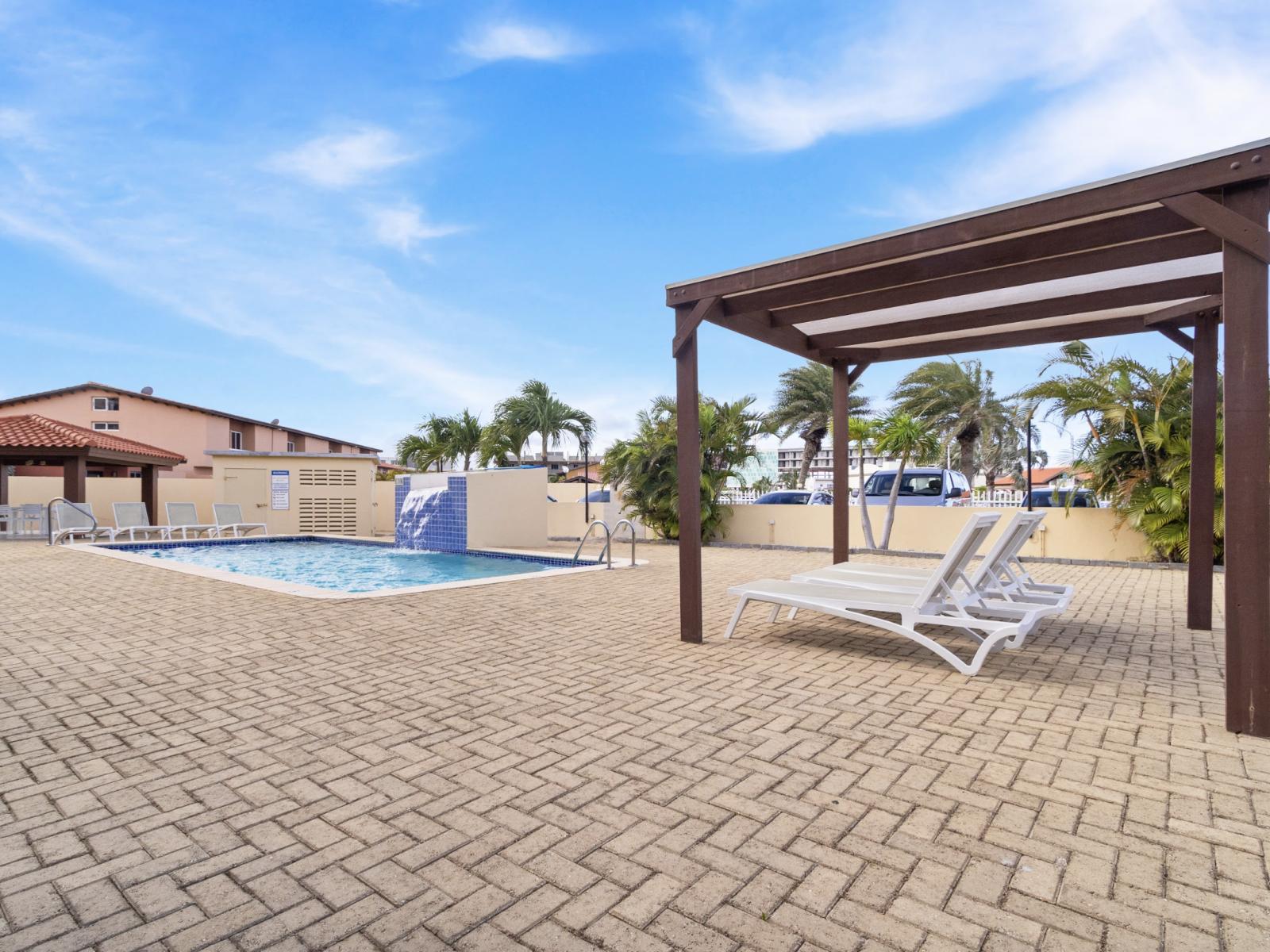 refreshing pool with plenty of lounge chairs to soak up the sun