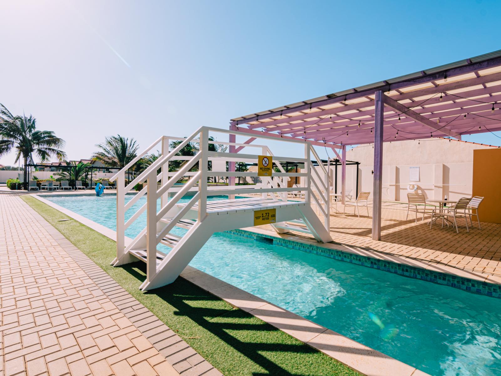 An abundance of greenery surrounding the pool