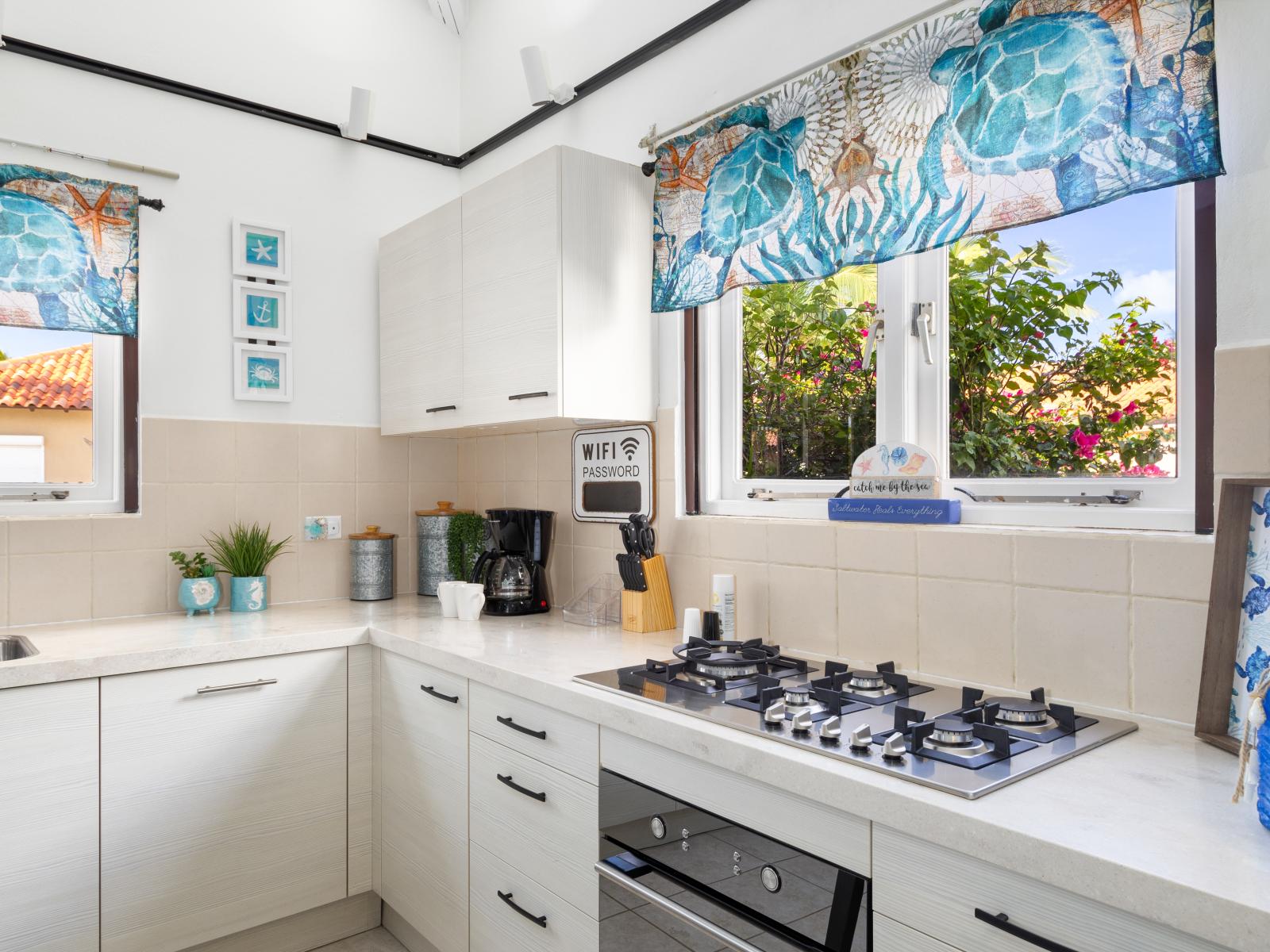 Luxurious and fully equipped kitchen of the 2BR Home in Noord, Aruba - Availability of all kitchen accessories - Elegant lighting - Large amount of storage - Sufficient space to walk and work according to your ease - Excellent bright space of villa