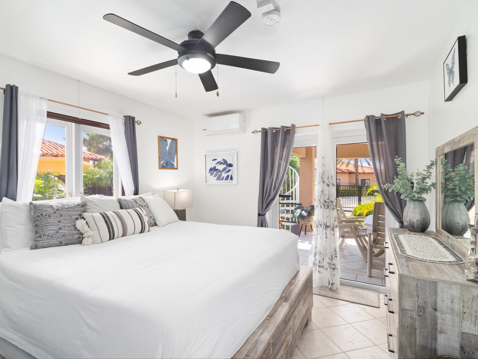 Sophisticated Bedroom of the 2BR Home in Noord Aruba - Comfy King size bed - Smart TV and Netflix - Easy Access to outdoor area