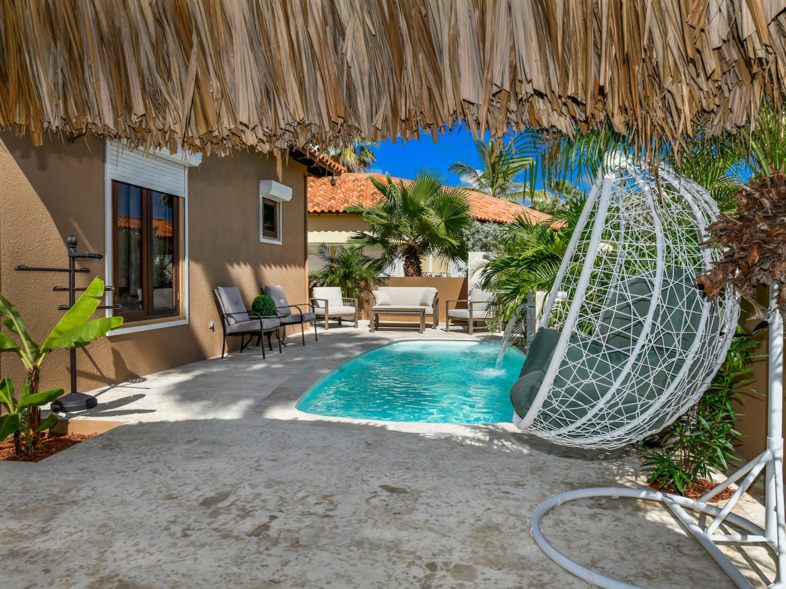 Splendid Private Pool of the 2BR Home in Noord Aruba - Cosy beach chairs available - Dive into refreshing poolside escape - Immerse yourself in the cool elegance of our pool - Experience ultimate relaxation in our poolside paradise