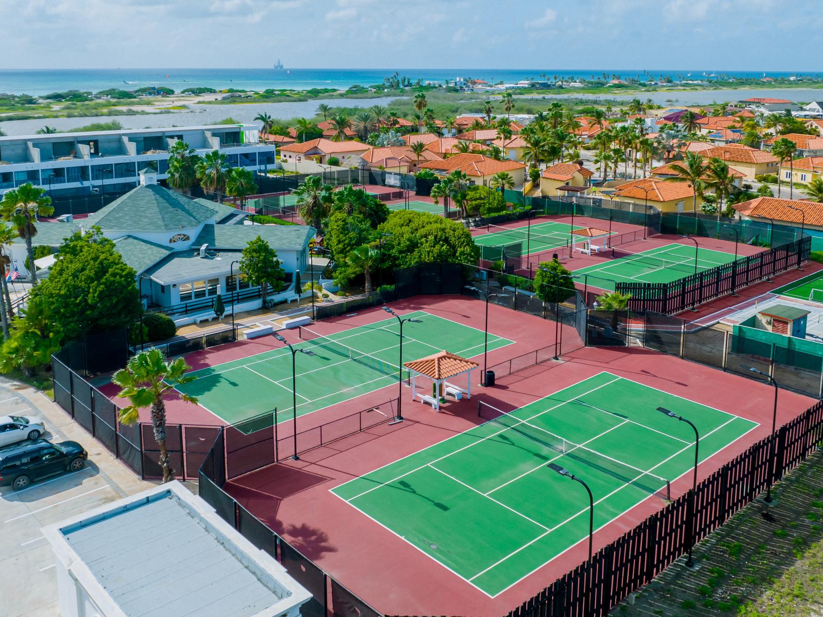 Ace your game on our pristine tennis courts at the Aruba Racquet Club, where passion for sport meets unparalleled views.