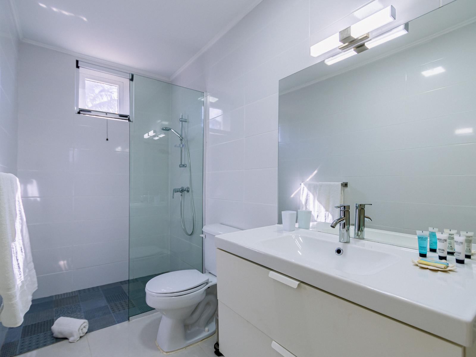 Enjoy the convenience of a walk-in shower in the second bedroom's bathroom, designed for ease and comfort.