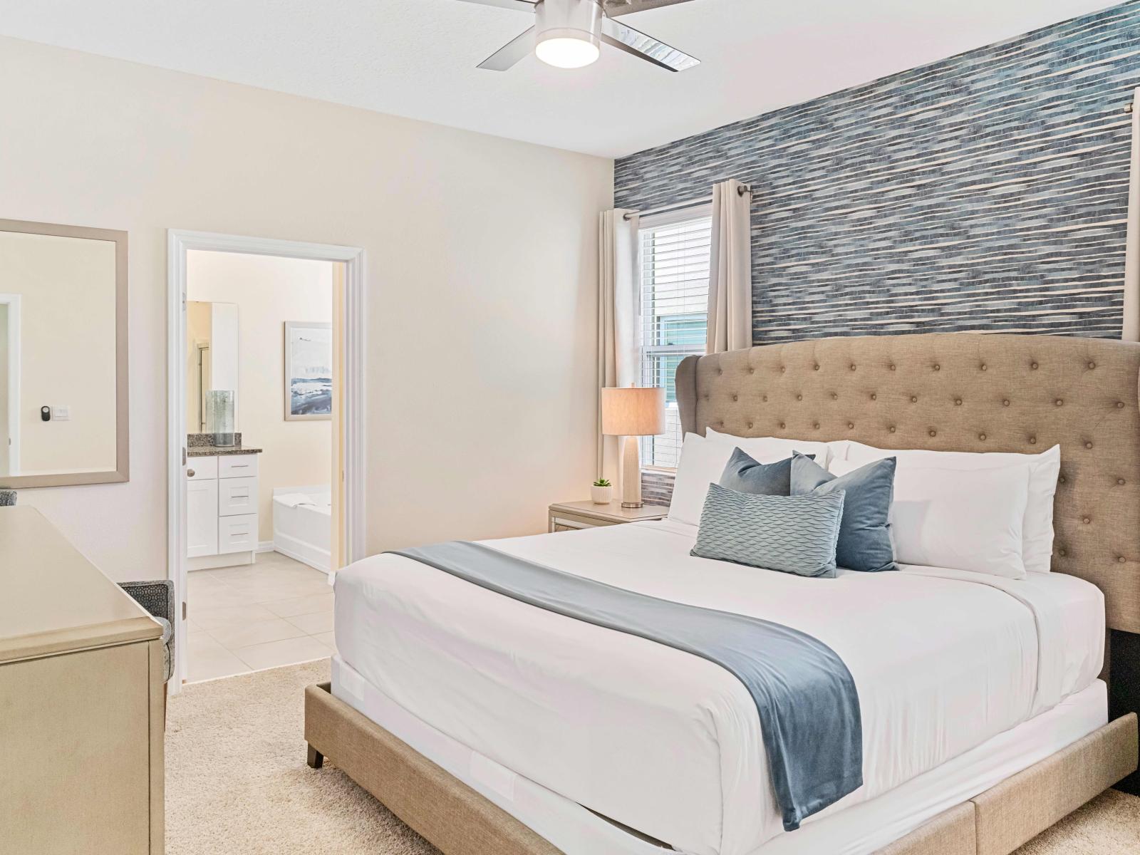 Bright bedroom of the home in Davenport Florida - Plush double bed for restful nights - Thoughtfully designed bedroom featuring functional and stylish furniture - Attached bathroom for privacy and convenience