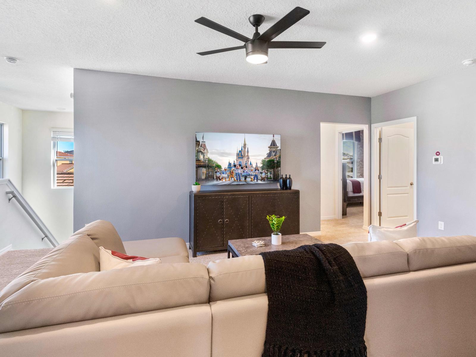 Comfortable living room (#2) featuring a flat-screen TV, ideal for unwinding after a long day.