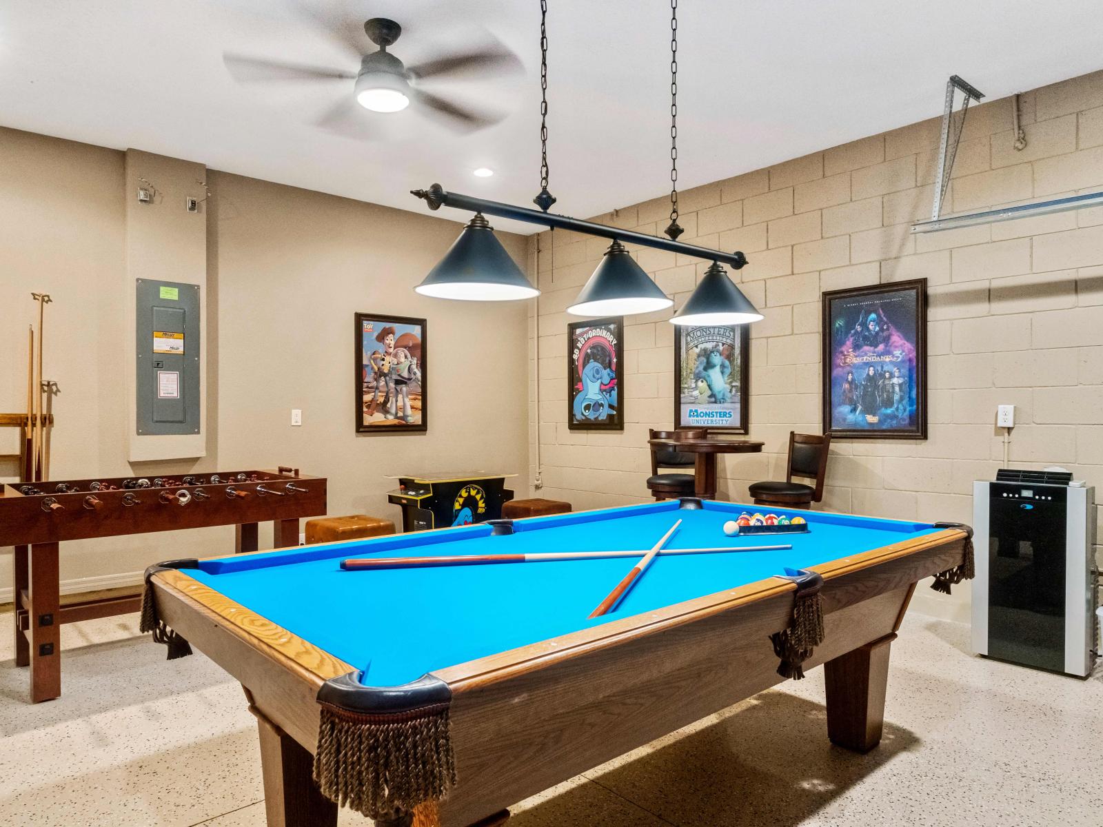 Exciting game room featuring a billiards table and foosball for hours of fun.