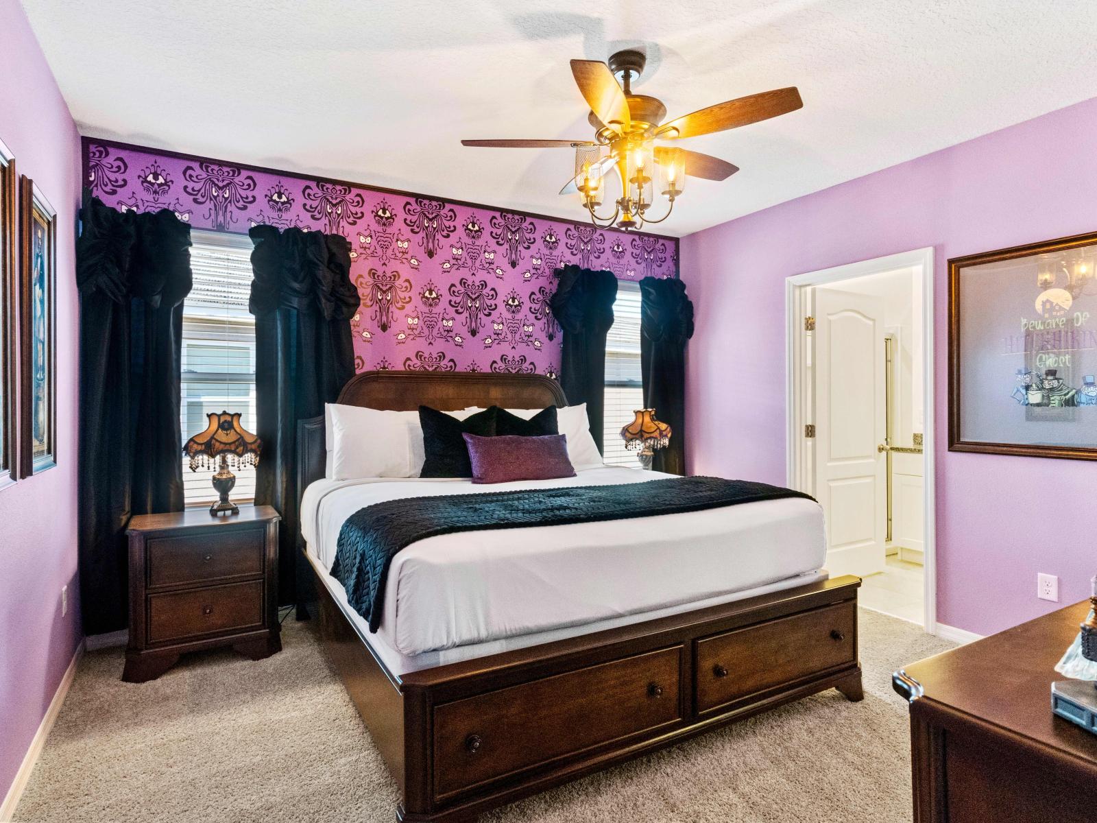 Immerse yourself in the eerie charm of our haunted mansion-themed King bedroom suite.