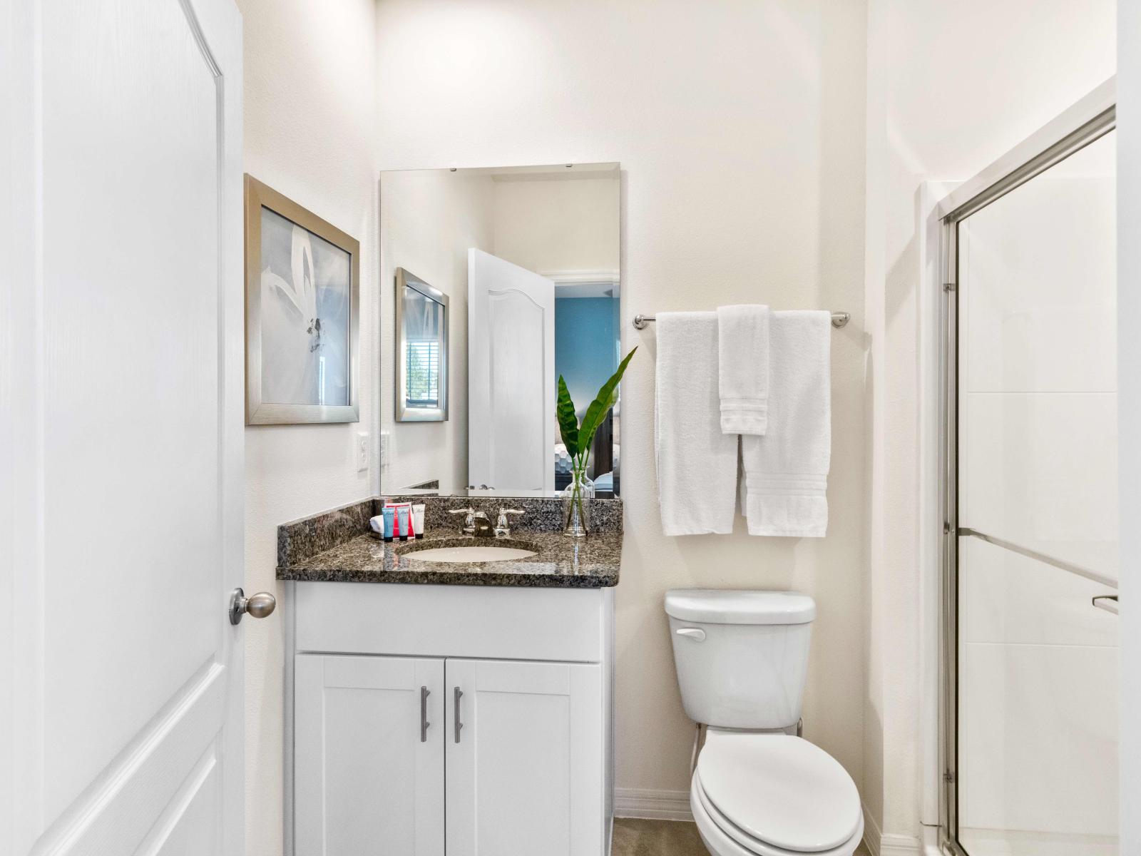 Indulge in luxury in our King en-suite featuring a full bath with a walk-in shower.