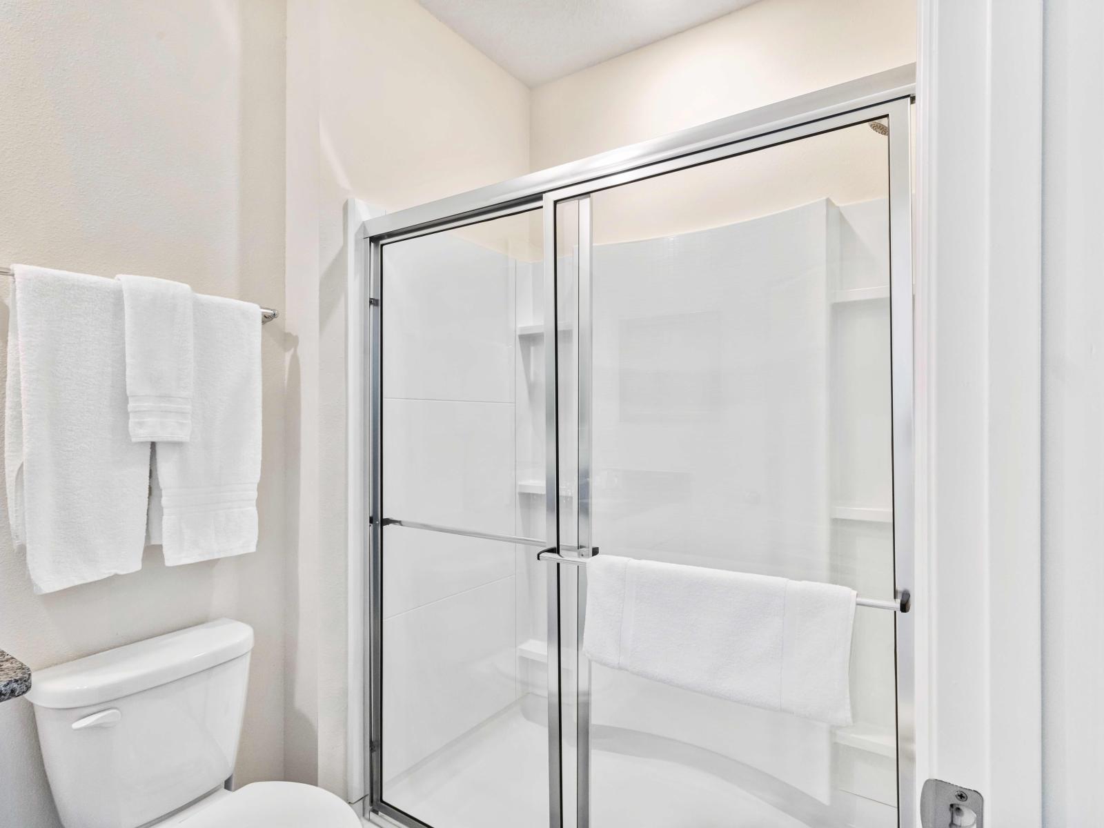 Enjoy comfort and convenience in our Queen en-suite, featuring a full bath with a walk-in shower.