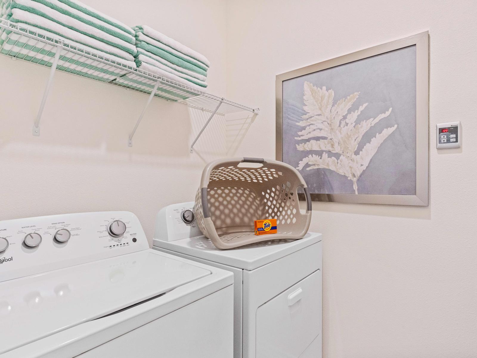 Convenient in-home laundry area with washer and dryer.