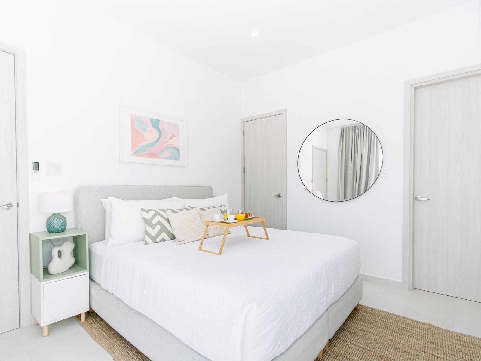 Deluxe bedroom of the Home in Oranjestad Aruba - Comfy king size bed - Well-appointed bedroom with neutral tones for a calming atmosphere - Smart TV and Netflix - Attached bathroom