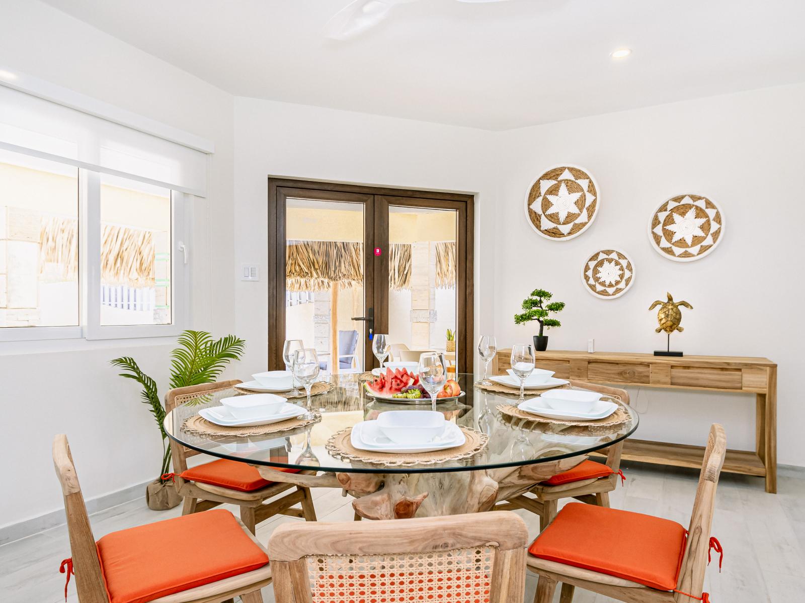 Radiant dinning area of the Villa in Noord, Aruba - 6 Persons Beautiful Dinning - Private dinning space with elite decor - Availability of TV and Netflix - Soul enhancing space - Large windows with beautiful outside view