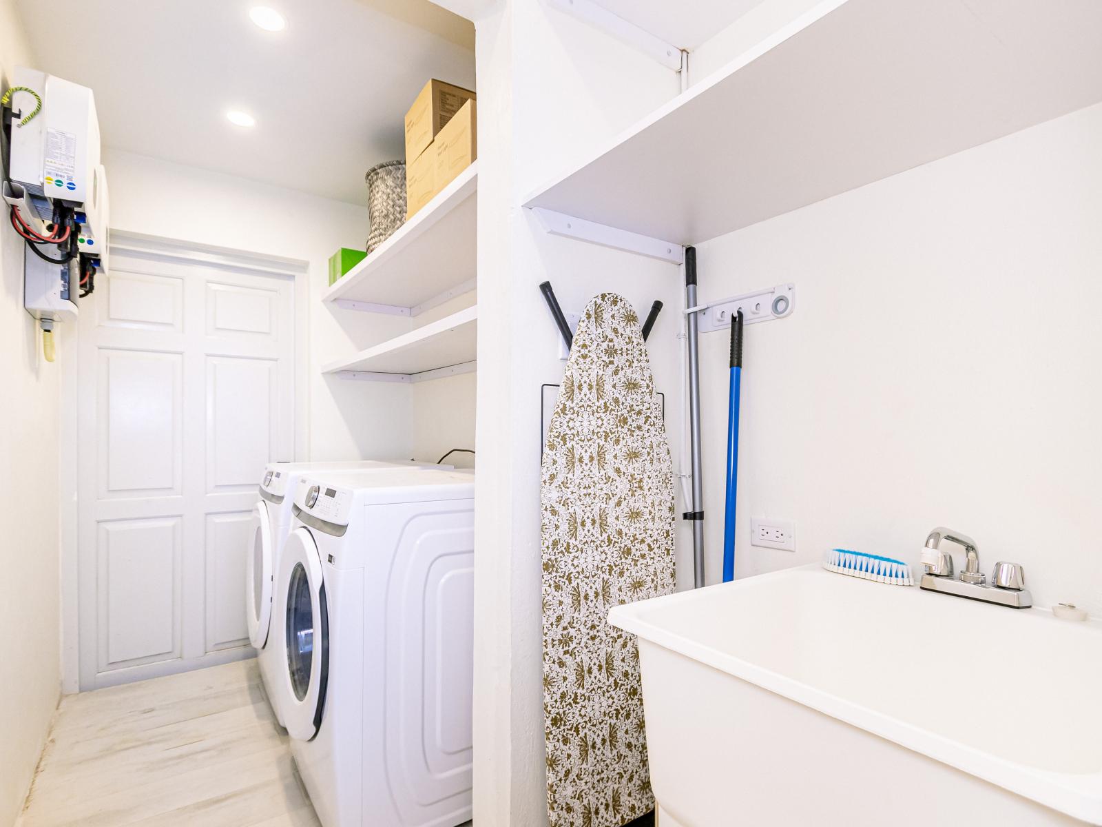 Explore our well-appointed laundry room, equipped with modern appliances for your convenience.