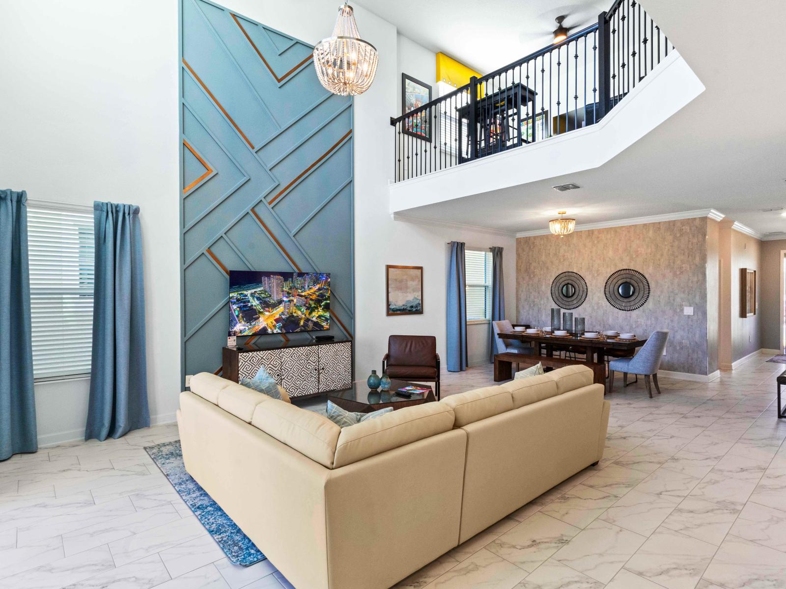 Modern Living Area of the Townhouse in Davenport Florida - Smart TV and Netflix - Open-concept living area seamlessly connected to a stylish dining space - Well-chosen lighting fixtures adding both functionality and charm