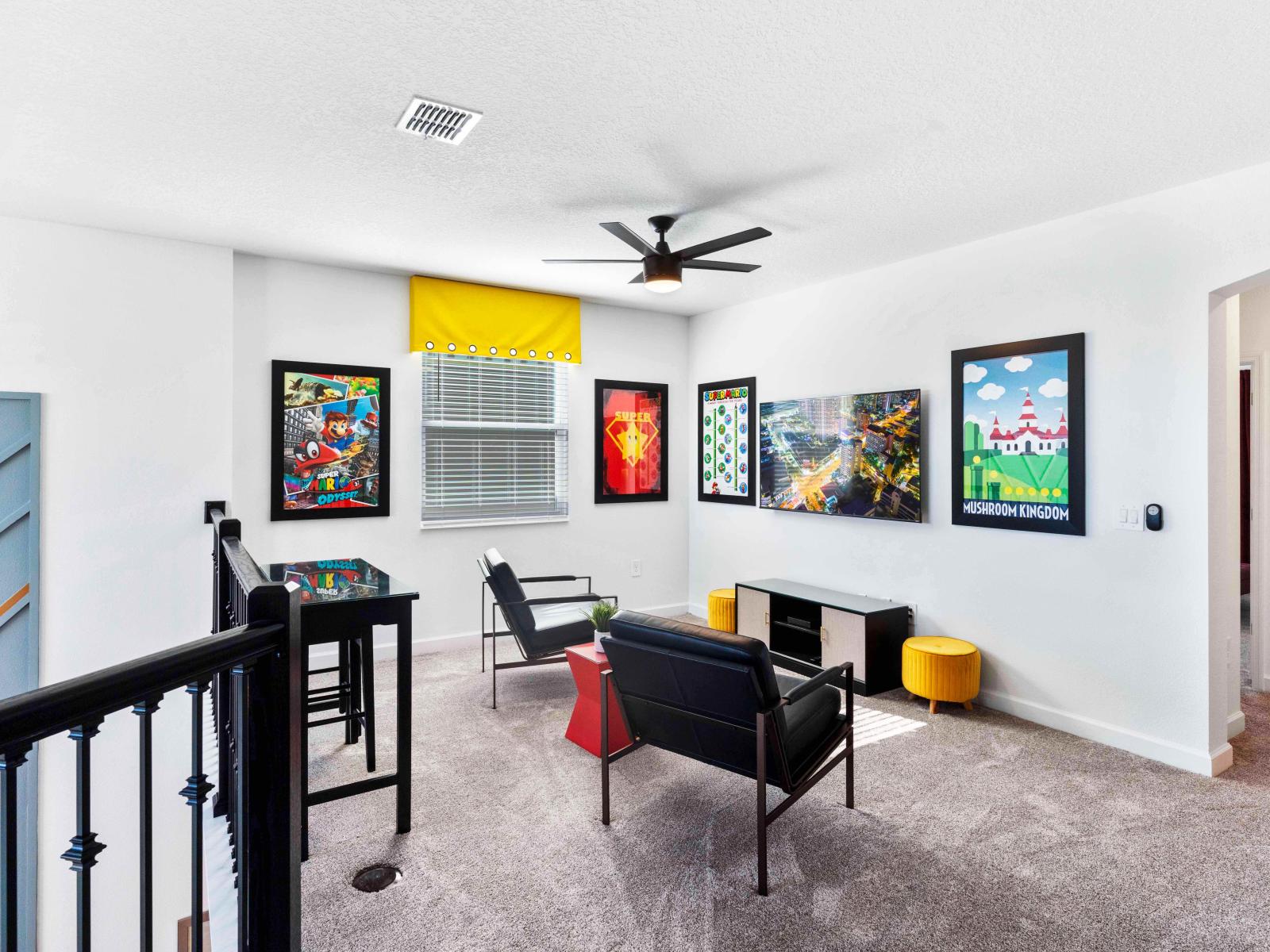 Fun lounge area of the Townhouse in Davenport Florida - Elevated Entertainment - Relax and unwind in our stylish lounge area - Featuring a TV for cozy nights and entertaining moments