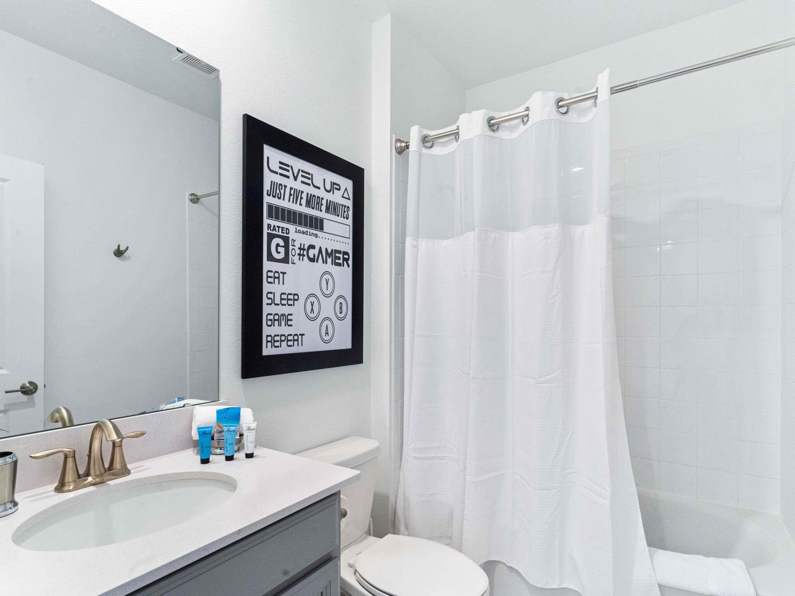 Gorgeous Bathroom of the Townhouse in Davenport Florida - Well-lit space with strategically placed mirrors for a spacious feel - Contemporary fixtures for a touch of indulgence - Seamless design featuring chic Vanity and Showr area