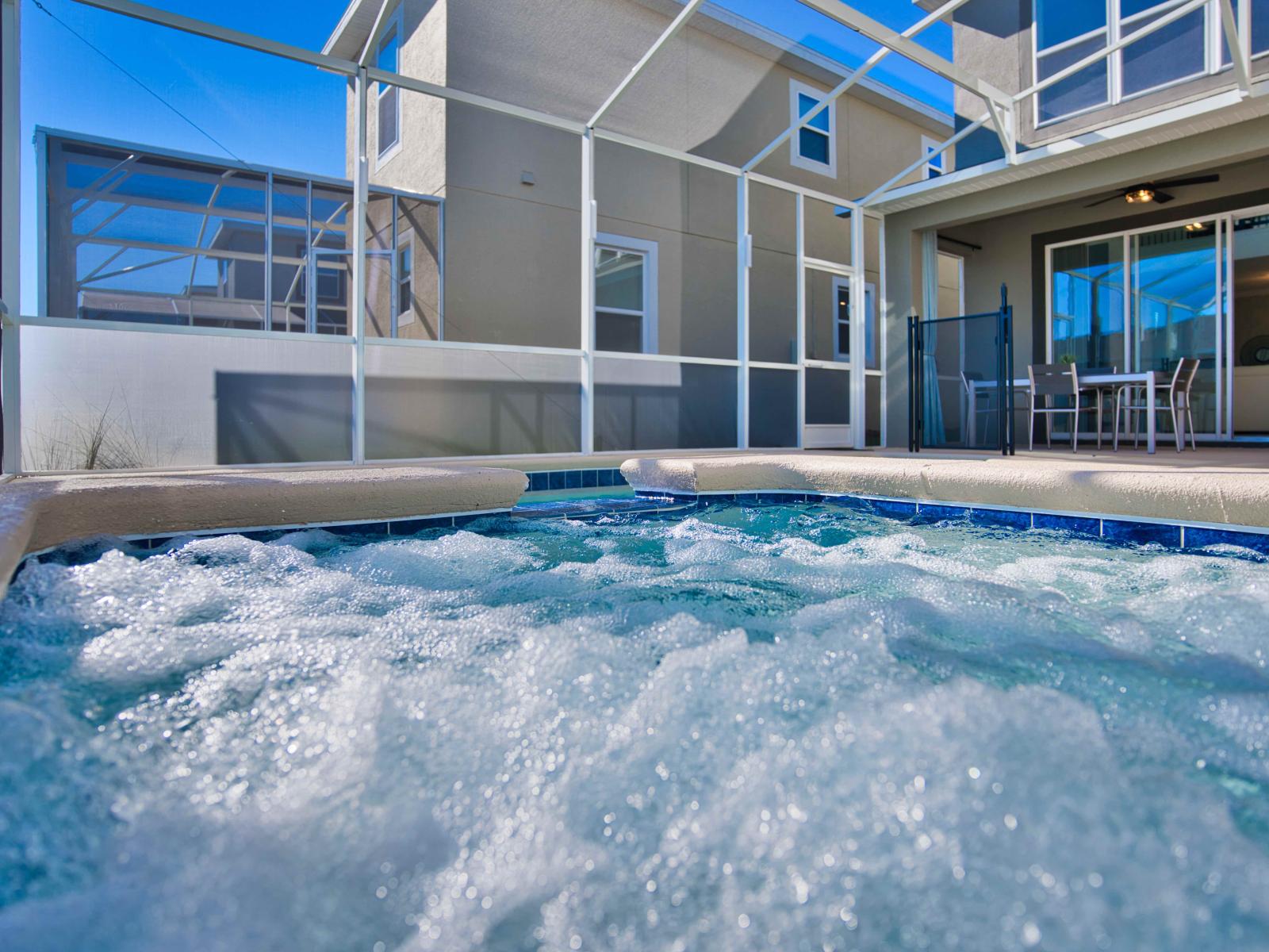 Lavish Private Pool Area of the Townhouse in Davenport Florida - Indulge in a rejuvenating experience in private outdoor Jacuzzi - Breathe in the fresh air, unwind in our outdoor lounge chair