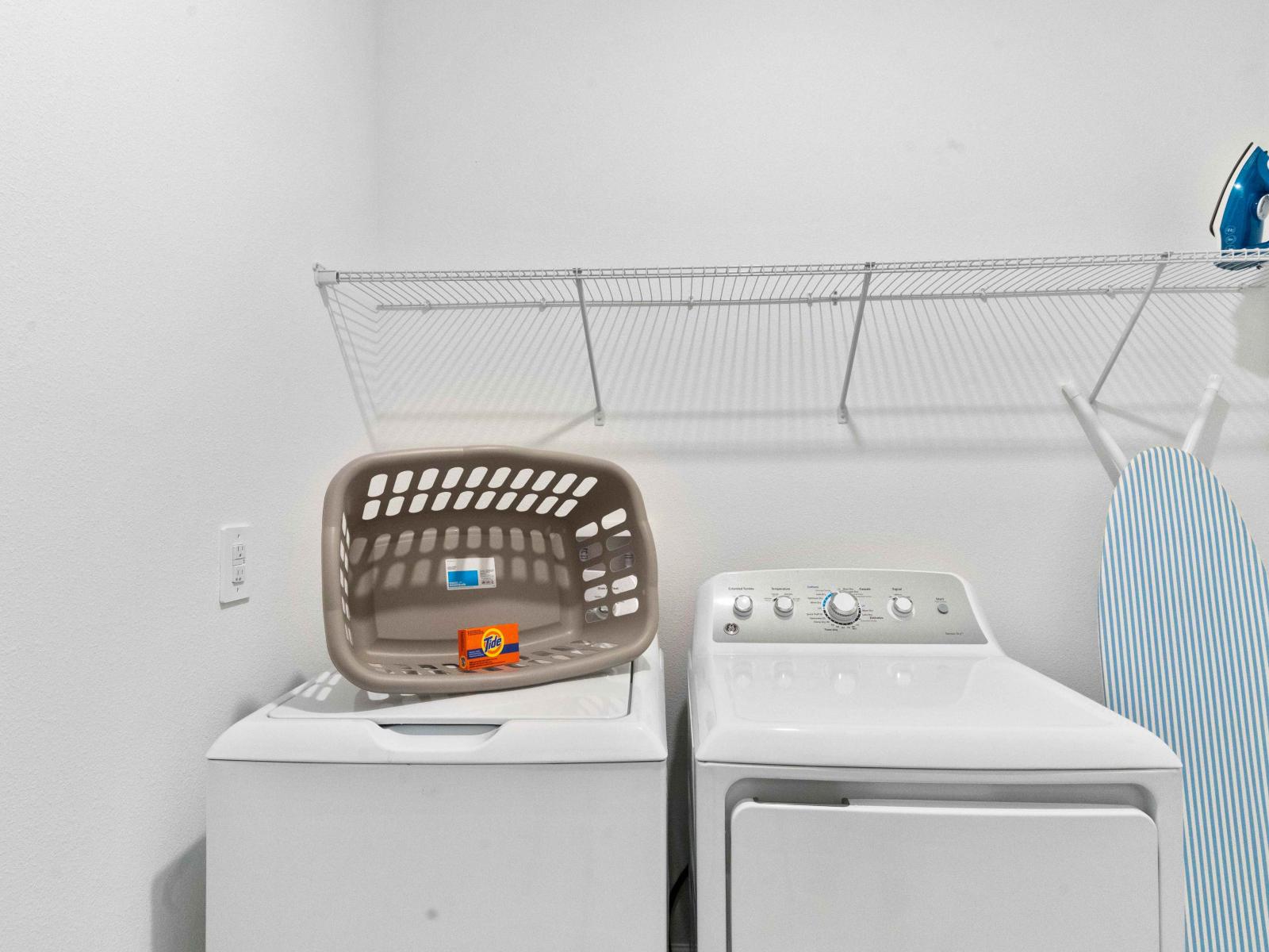 Clean laundry room of the Townhouse in Davenport Florida - Step into our laundry room - Equipped with a washer and dryer - Chores become a breeze amidst convenience and comfort