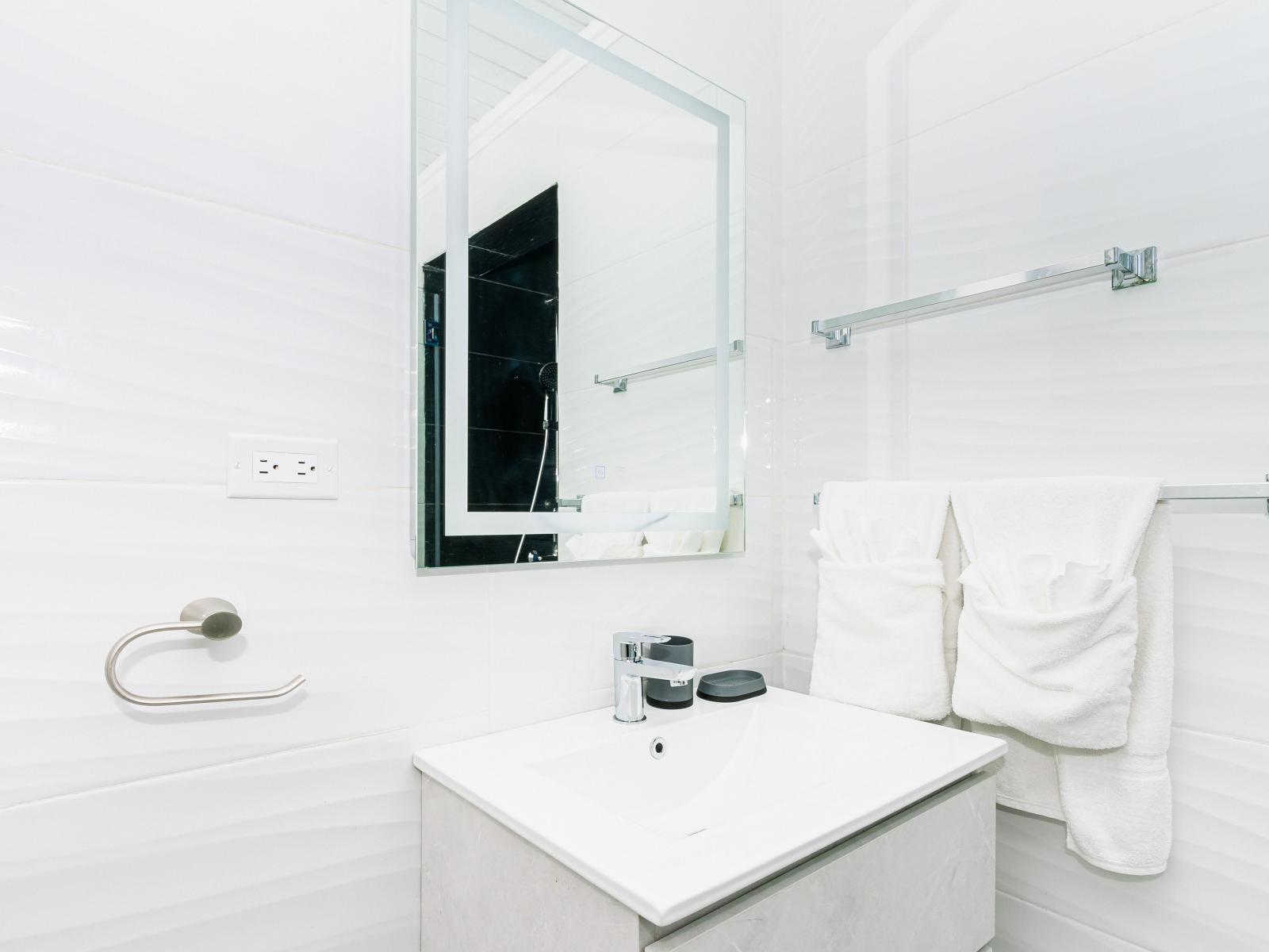 Step into luxury with our sleek walk-in shower in Bathroom 2!