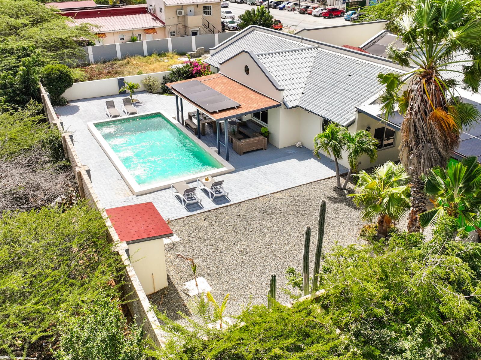 Experience luxury from above with this captivating drone shot of our inviting pool oasis!