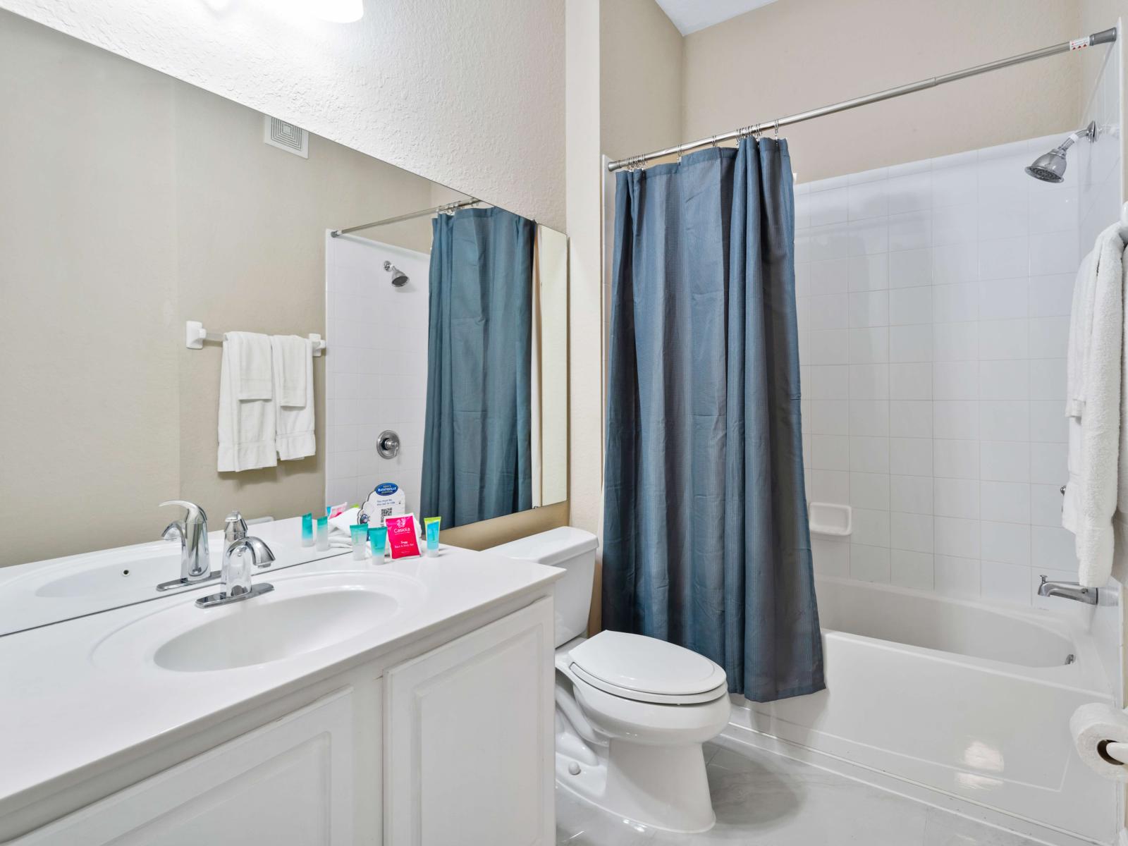 Bathroom 2 with a bathtub and a shower combination