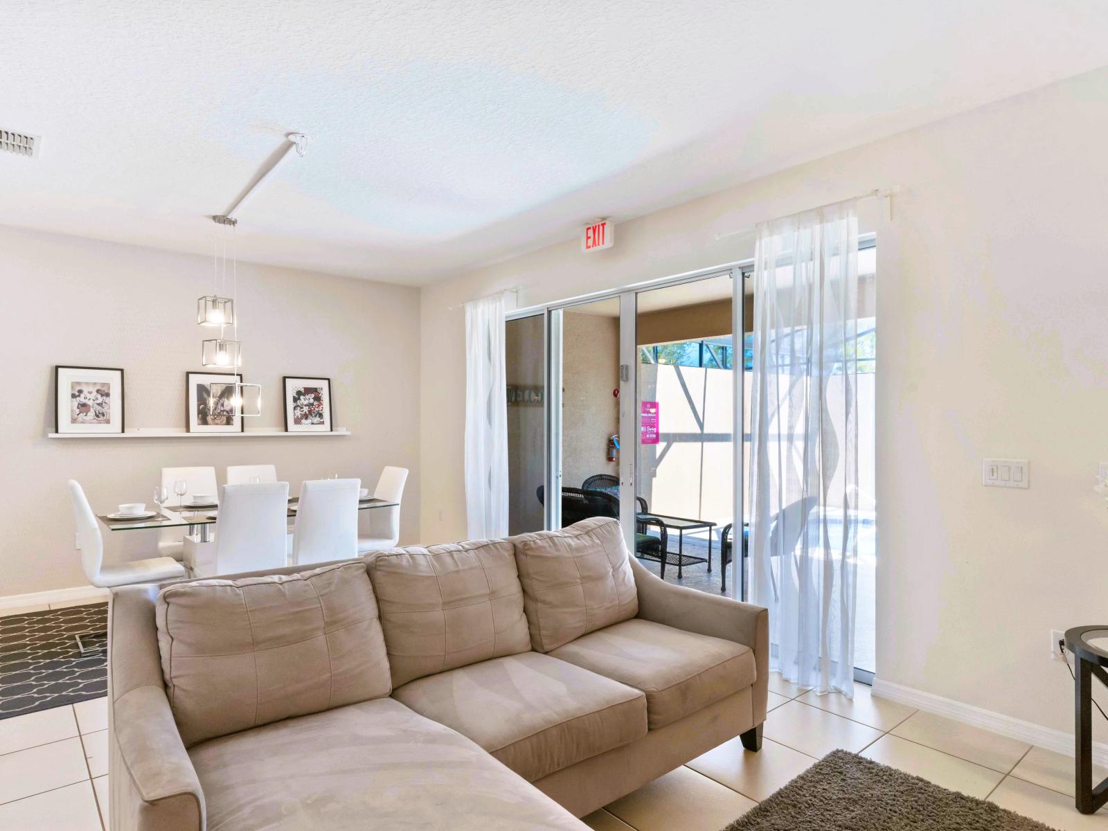 Sleek living area of the townhouse in Davenport Florida - Well-chosen lighting fixtures adding both functionality and charm - Stylish furniture arrangement providing comfort and a cohesive look