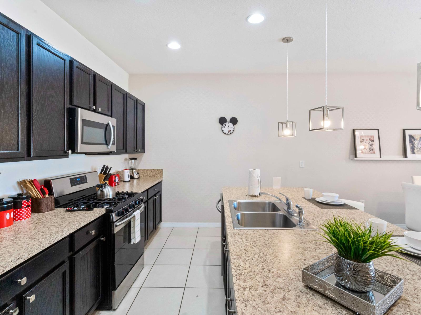 Beautiful kitchen of the townhouse in Davenport Florida - Smart use of space with versatile storage solutions - Open concept connecting the kitchen to the dining and living area - Integrated appliances for a seamless and stylish appearance