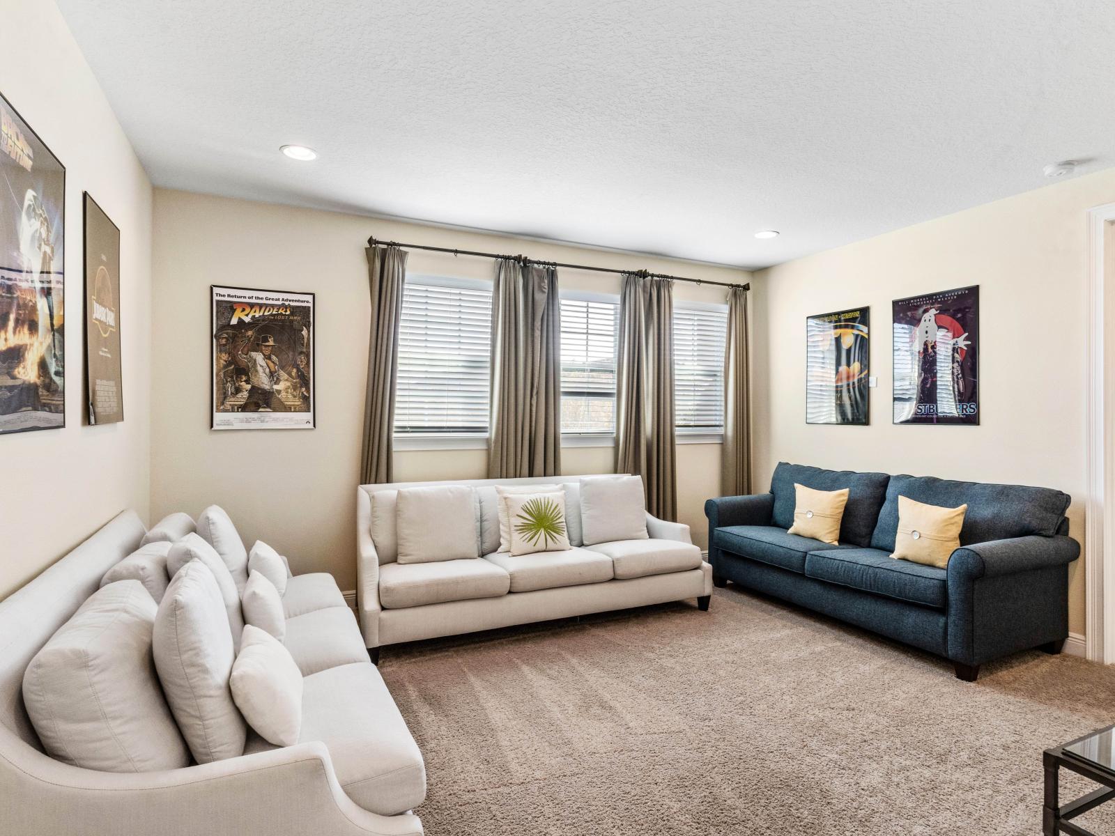 Stylish Living Area of the Home in Kissimmee Florida - Smart TV and Netflix - Plush seating arrangements invite relaxation and stylish gatherings - High ceilings contribute to an airy and open atmosphere