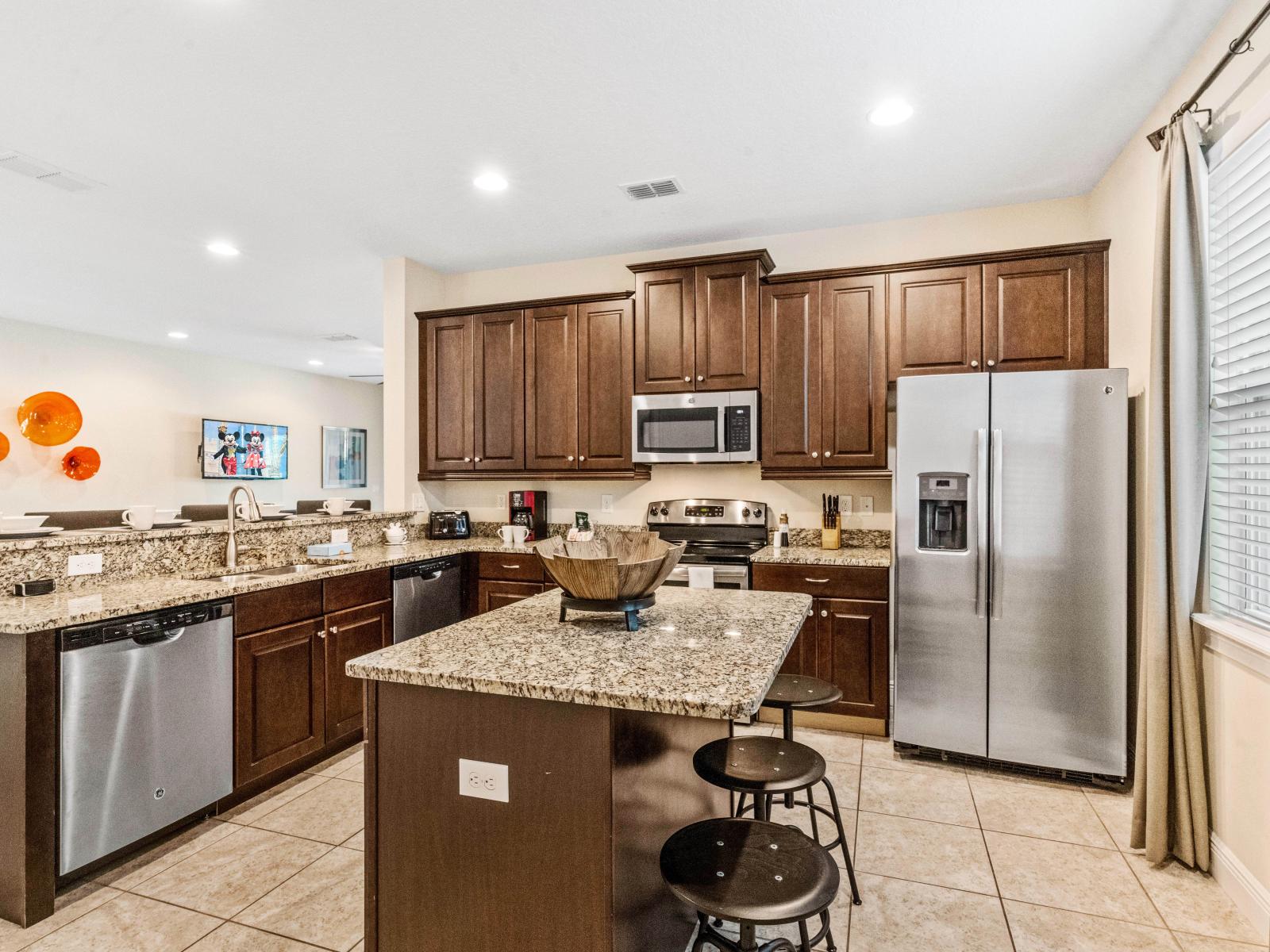 Lofty Kitchen of the Home in Kissimmee Florida - Fully Equipped Kitchen  - Granite Counters, Stainless Steel Appliances - Breakfast bar with High Chairs