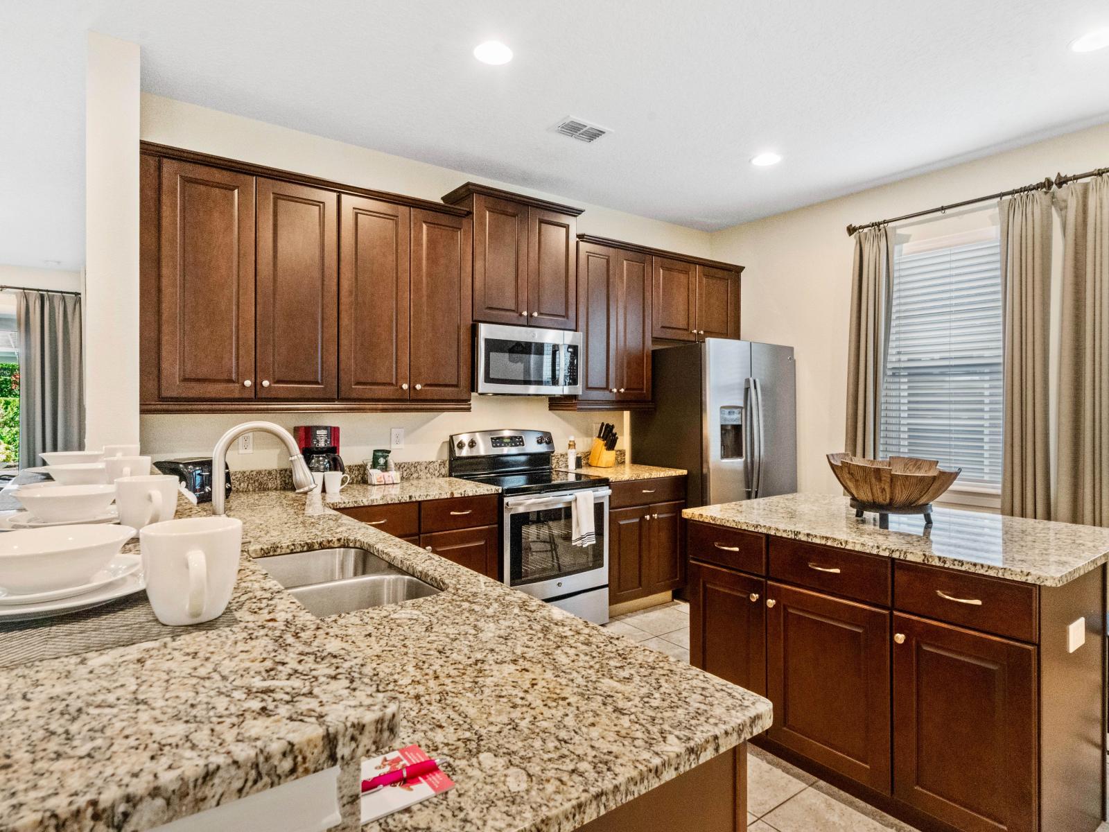 Spacious Kitchen of the Home in Kissimmee Florida - Unleash Your Culinary Creativity - Functional layout designed for efficient meal preparation - Integrated appliances for a seamless and stylish appearance