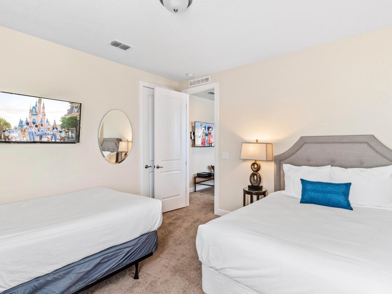 Plush Bedroom of the Home in Kissimmee Florida - Featuring Two comfy Beds for a Relaxing Stay - Smart TV and Netflix - Well-appointed bedroom with neutral tones for a calming atmosphere