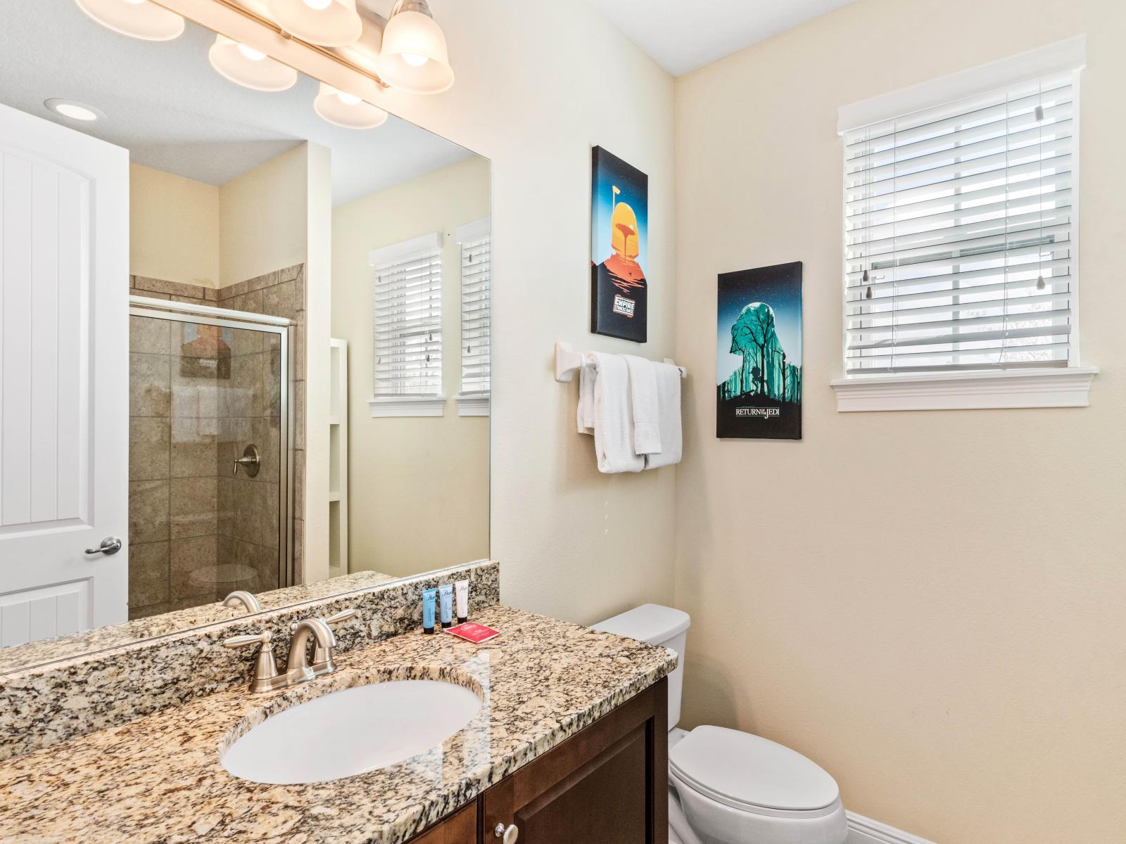 Well-Appointed Bathroom of the Home in Kissimmee Florida - Comfortable and enjoyable - Contemporary fixtures for a touch of indulgence - Seamless design featuring a glass-enclosed shower