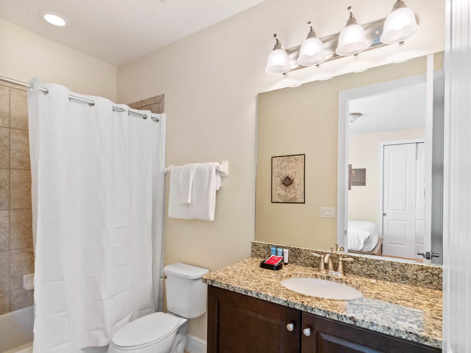 Tranquil Bathroom of the Home in Kissimmee Florida - Offering rejuvenating amenities and a soothing atmosphere - Sliding curtains added privacy