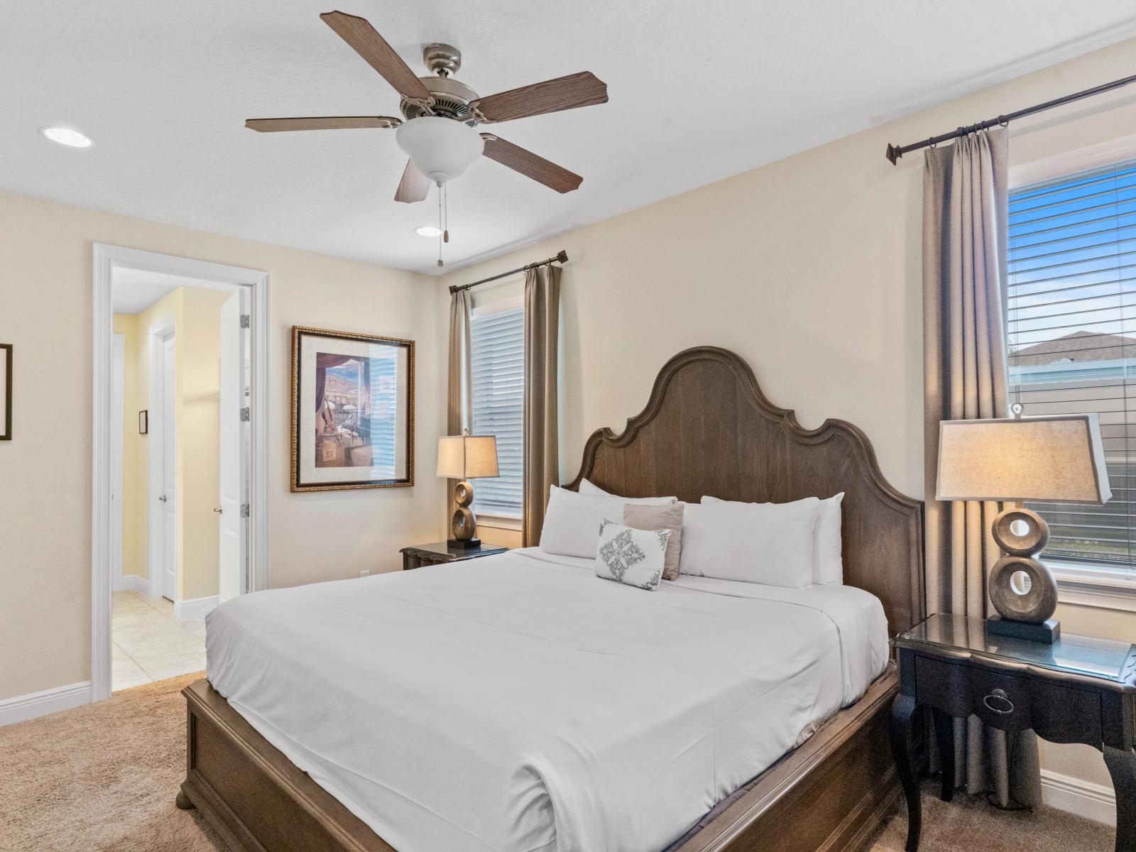 Lavish Bedroom of the Home in Kissimmee Florida - Spacious bedroom offering comfort and style - Bright and airy bedroom with windows for natural illumination - Elegant Decor