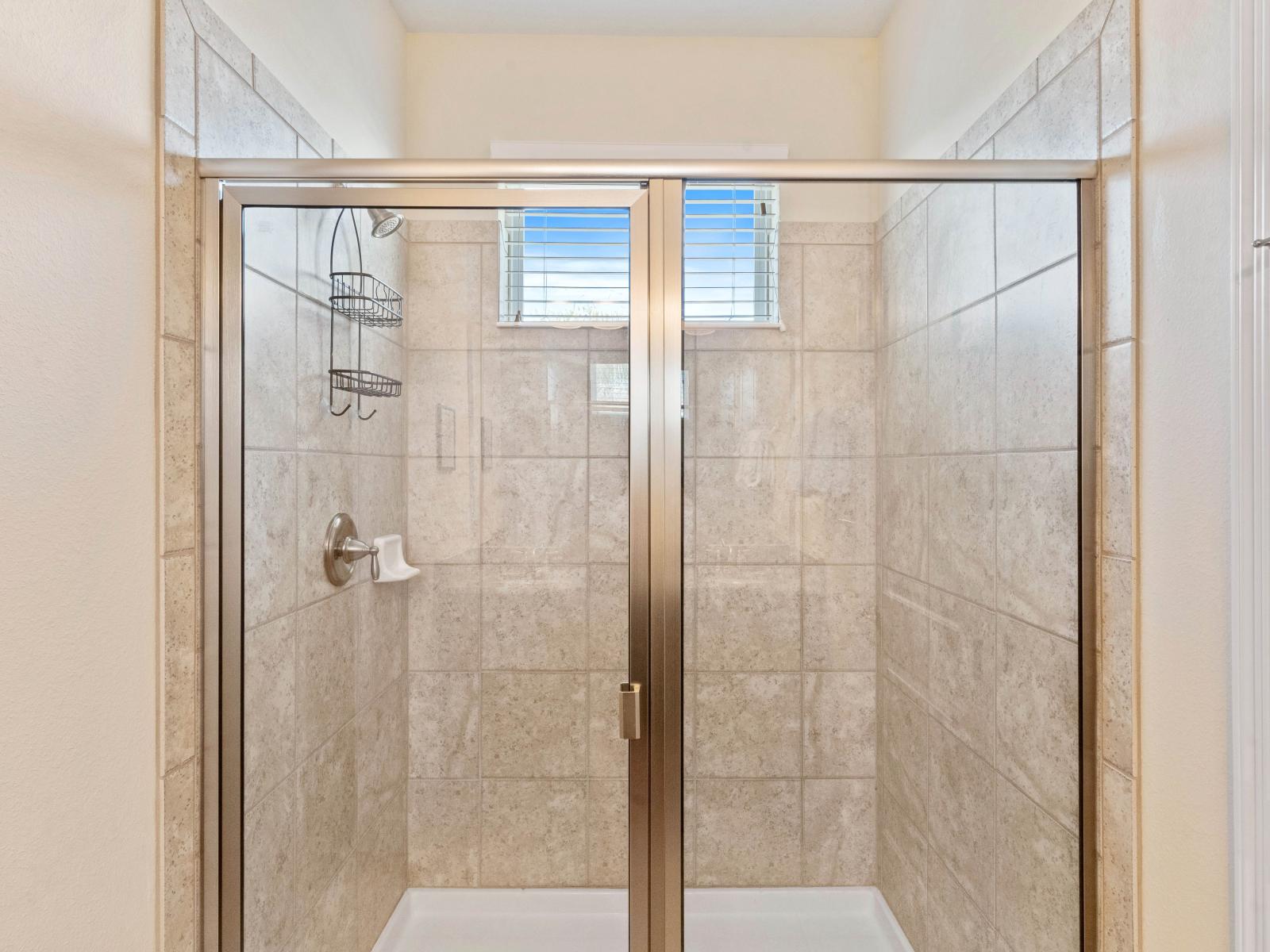 Regal Bathroom of the Home in Kissimmee Florida - Spacious Walk-In Shower Stall - Well-lit space  - Understated elegance with clean lines and refined details