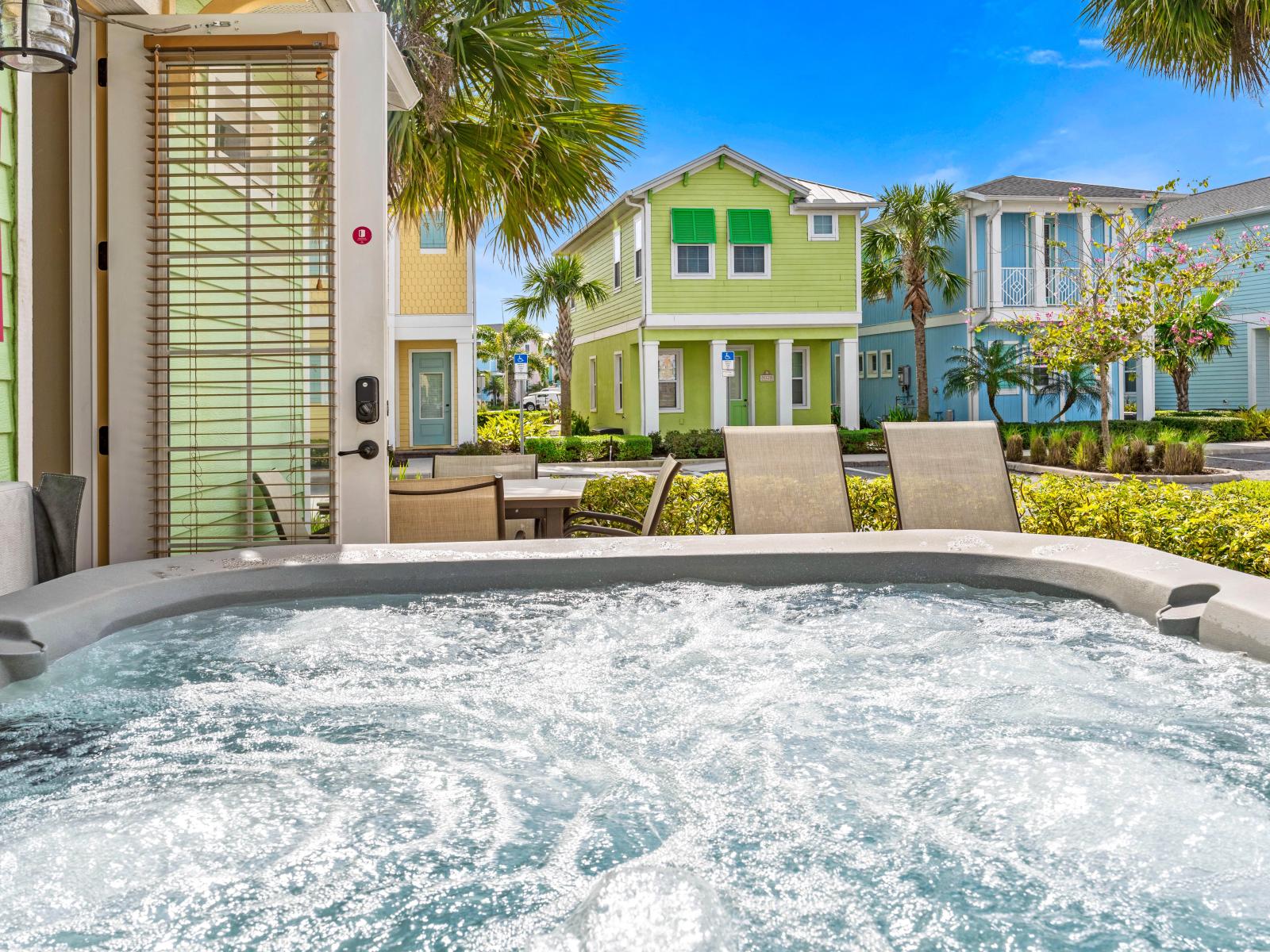 Outdoor Back Patio Area -- *Jacuzzi Tub, Patio Table+ Sun Loungers* - After a busy day, this jacuzzi tub is the best place to relax at the outdoor back patio area.