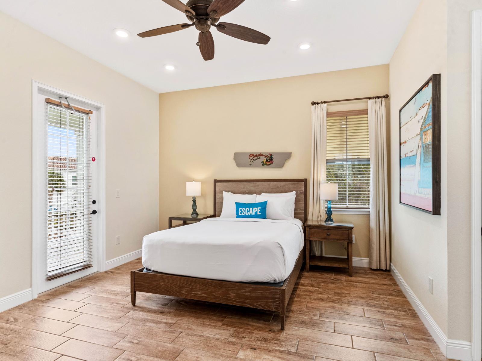 Comfy bedroom of the cottage in Kissimmee Florida - Direct access to the outdoor patio area - Thoughtfully designed bedroom featuring functional and stylish furniture - Luxurious bedding for a restful night's sleep