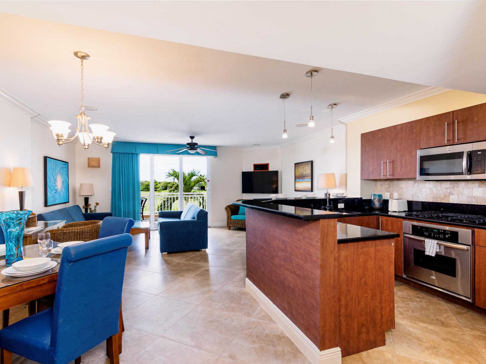 Lavish living and dinning area of the condo in Noord Aruba - Cozy sofas - Elite 4 persons dining - Beautifully located large glass doors that leads to private balcony with mesmerizing views - Elite ambiance - Availability of TV and Netflix