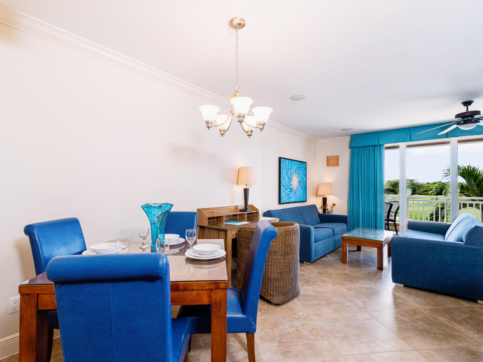 Marvelous dinning area of the condo in Noord Aruba - Beautiful balcony facing dinning area of the villa - Elite 4 persons dinning - Stunningly located large windows with mesmerizing views - Majestic decored space with beautiful chandelier