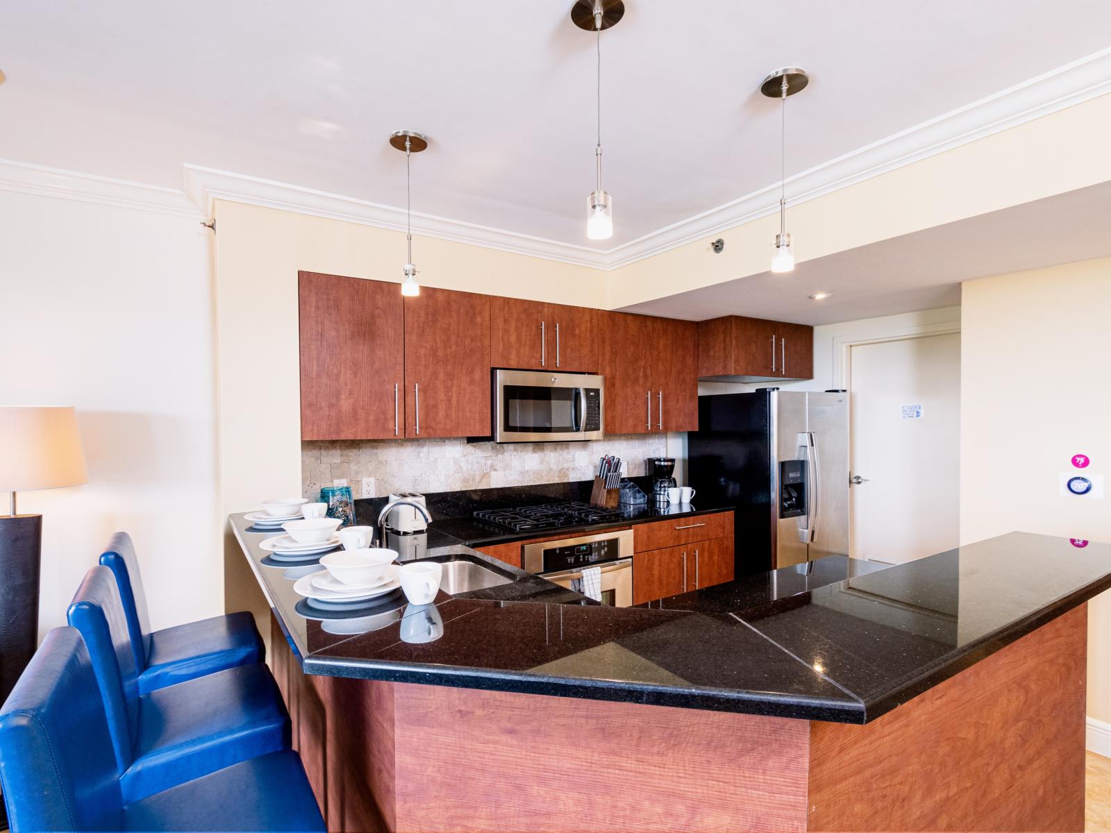 Modern Kitchen Area of the condo in Noord Aruba - Fully Equipped - Functional layout designed - Storage space for organized and clutter-free counters - Open concept connecting the kitchen to the Dining and Living Area - Breakfast bar