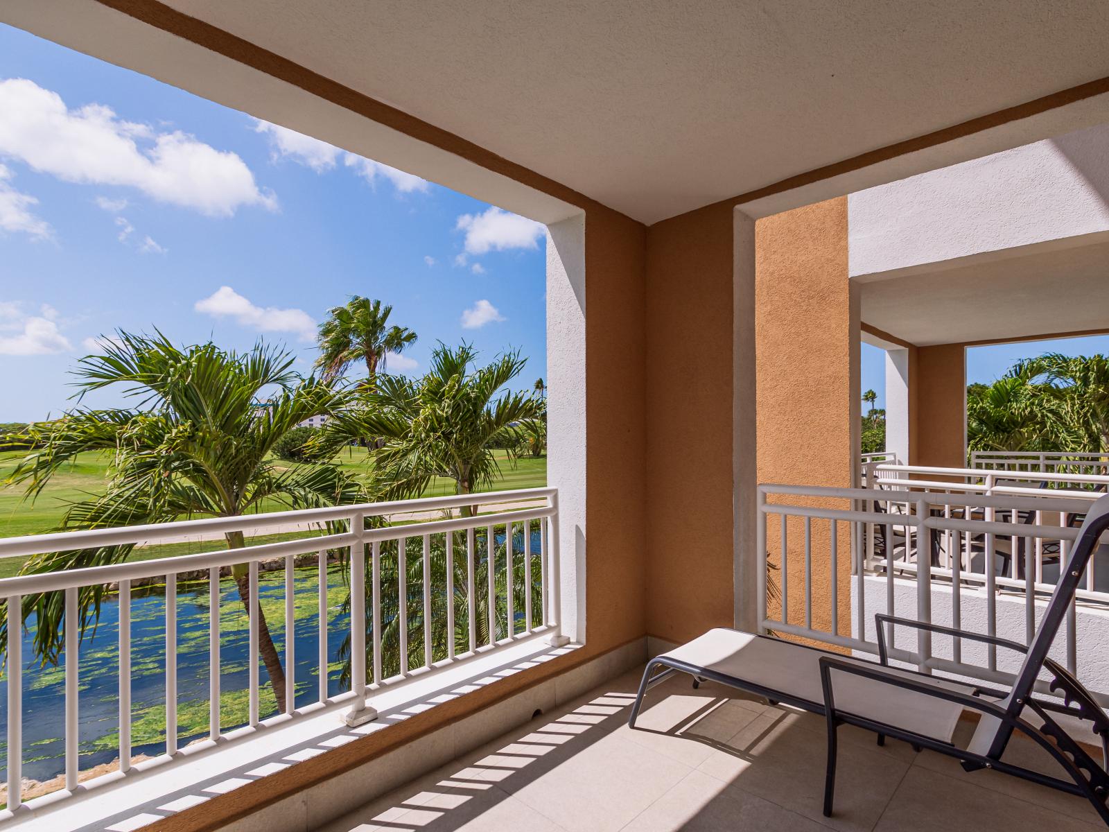 Phenomenal Balcony of the condo in Noord Aruba - Sip, savor, and soak up the scenery from our outdoor seating haven - Panoramic views of the surrounding area - A splash of nature's beauty