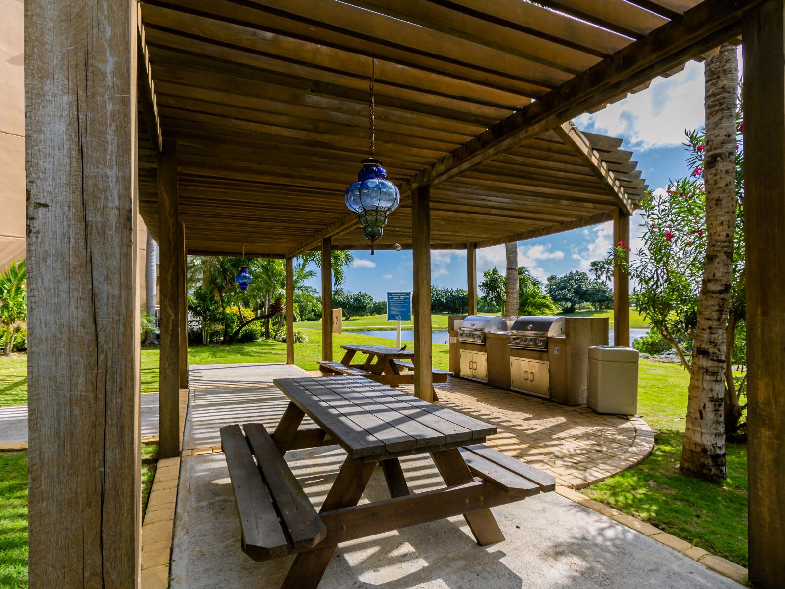 Unwind lakeside: Experience the perfect blend of relaxation and excitement at Divi Village's BBQ spot, surrounded by serene greenery and refreshing vibes.