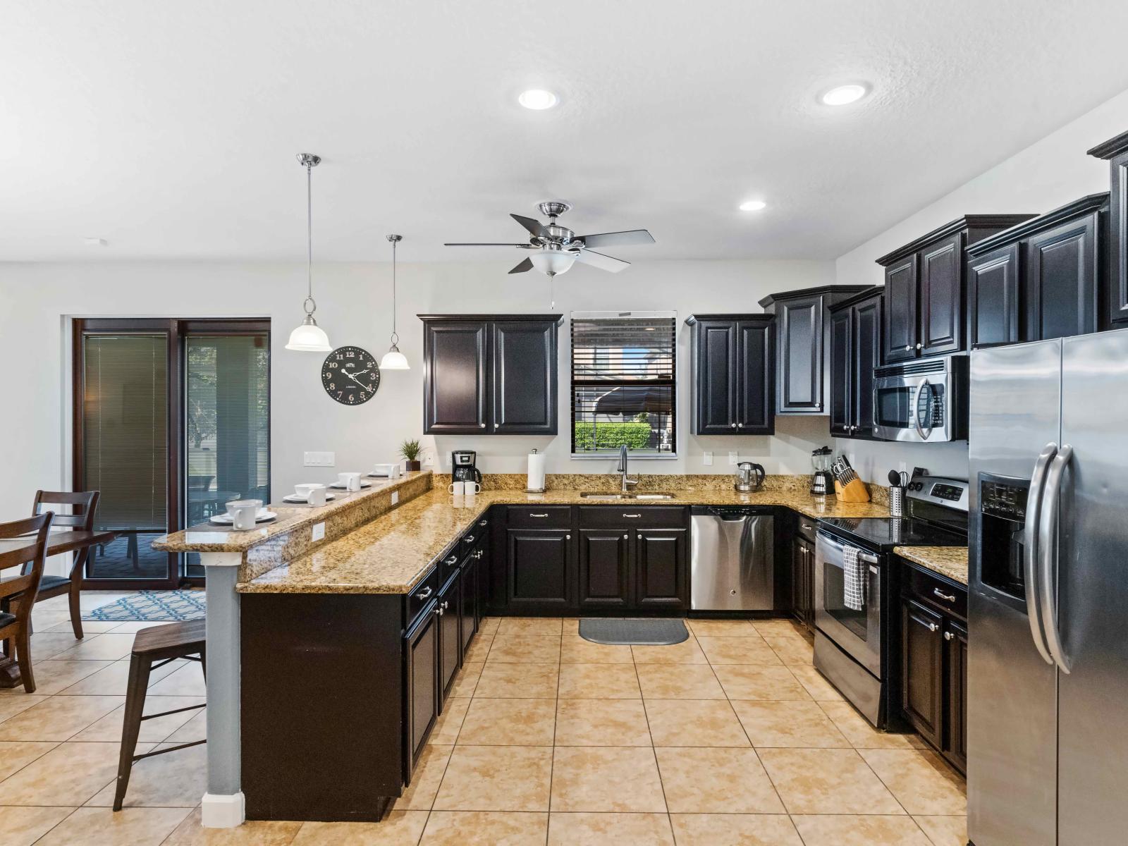 This modern kitchen comes with beautiful granite counter tops and stainless steel appliances, along with everything you need to cook up your family's favorite home-cooked meals.