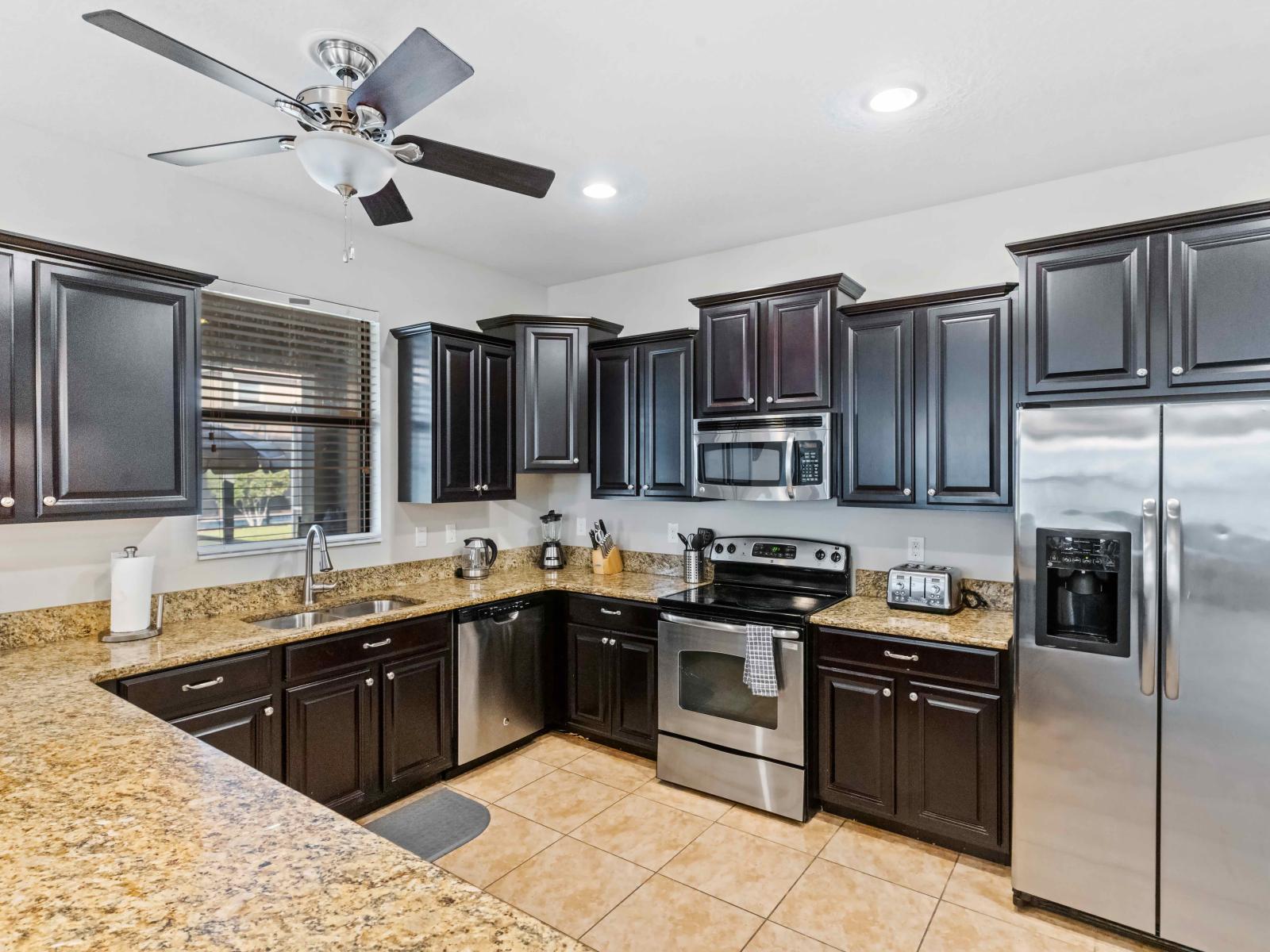 The Kitchen has  ample counter space, modern appliances, and room to move, it provides the perfect environment for cooking delicious meals, entertaining guests, and creating lasting memories during your stay.