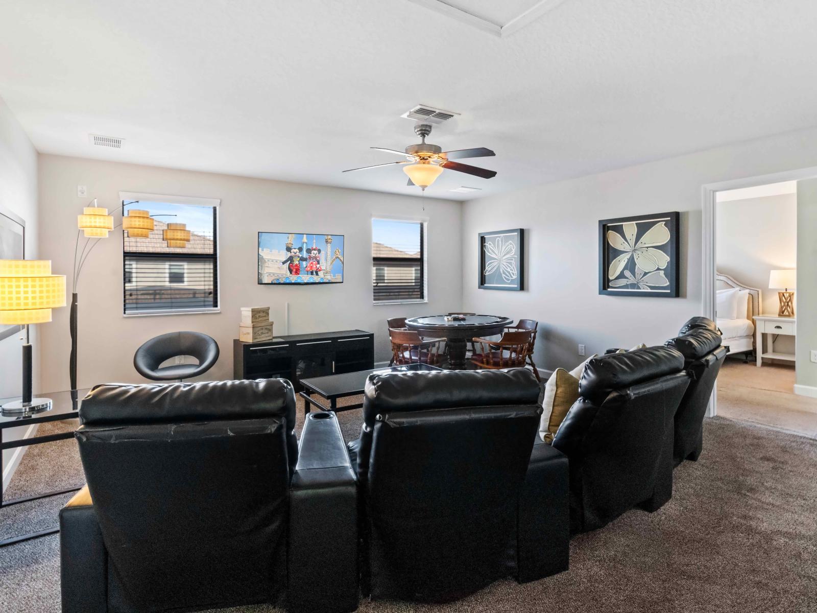 The Living room  boasts spaciousness with its large couches, creating a comfortable and inviting lounge area.