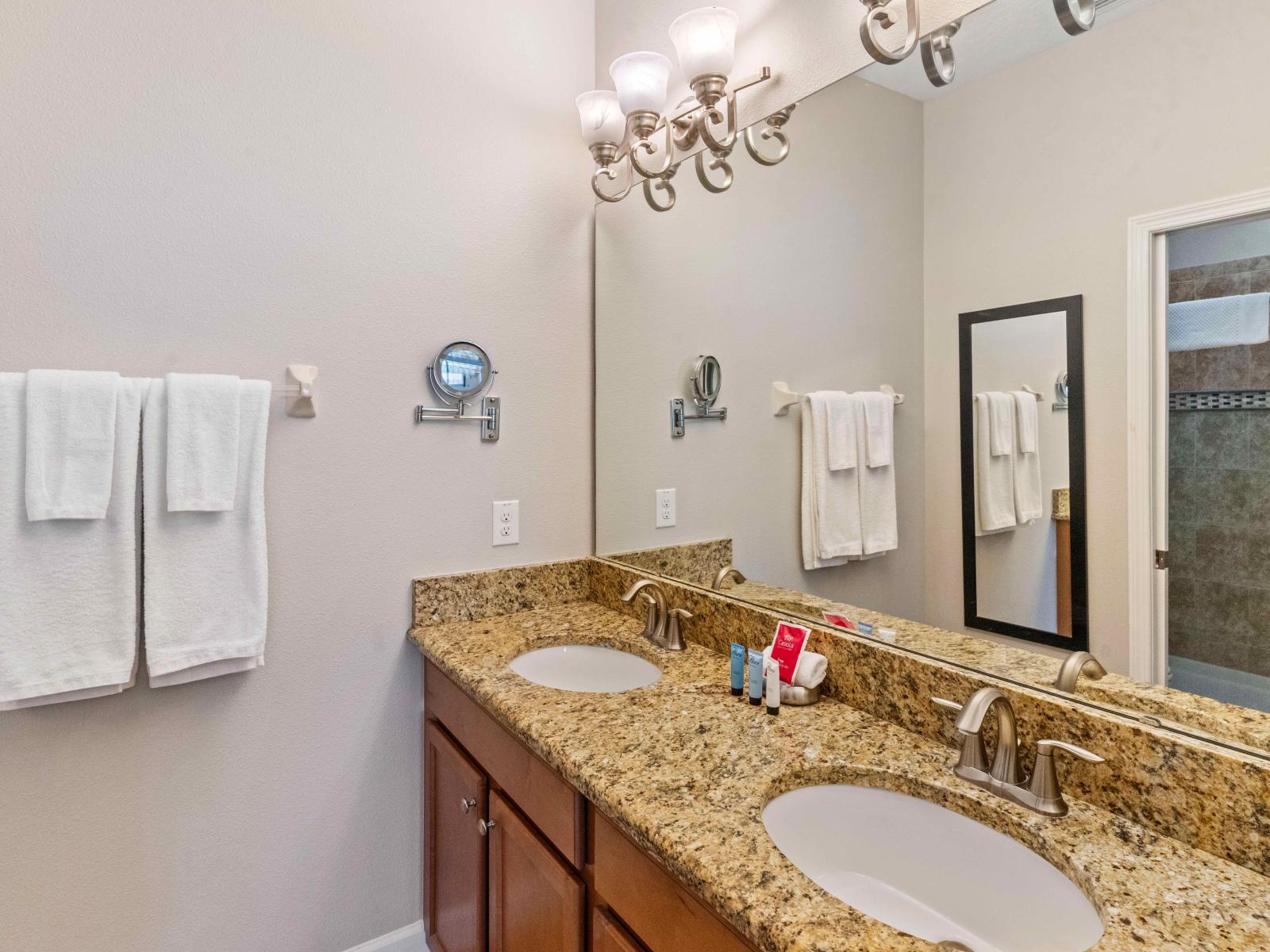 The vanity space in the bathroom is a personal grooming sanctuary.