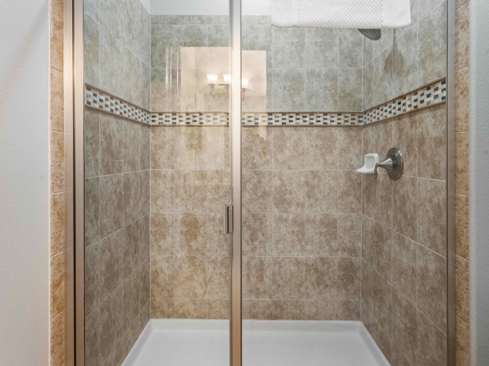 The enclosed shower room provides guests with a secluded haven for rejuvenation.